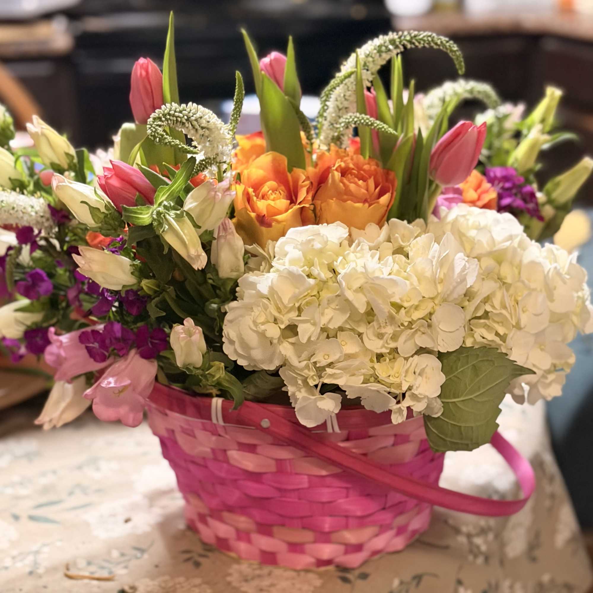 This blooming basket is filled to the brim with a variety of