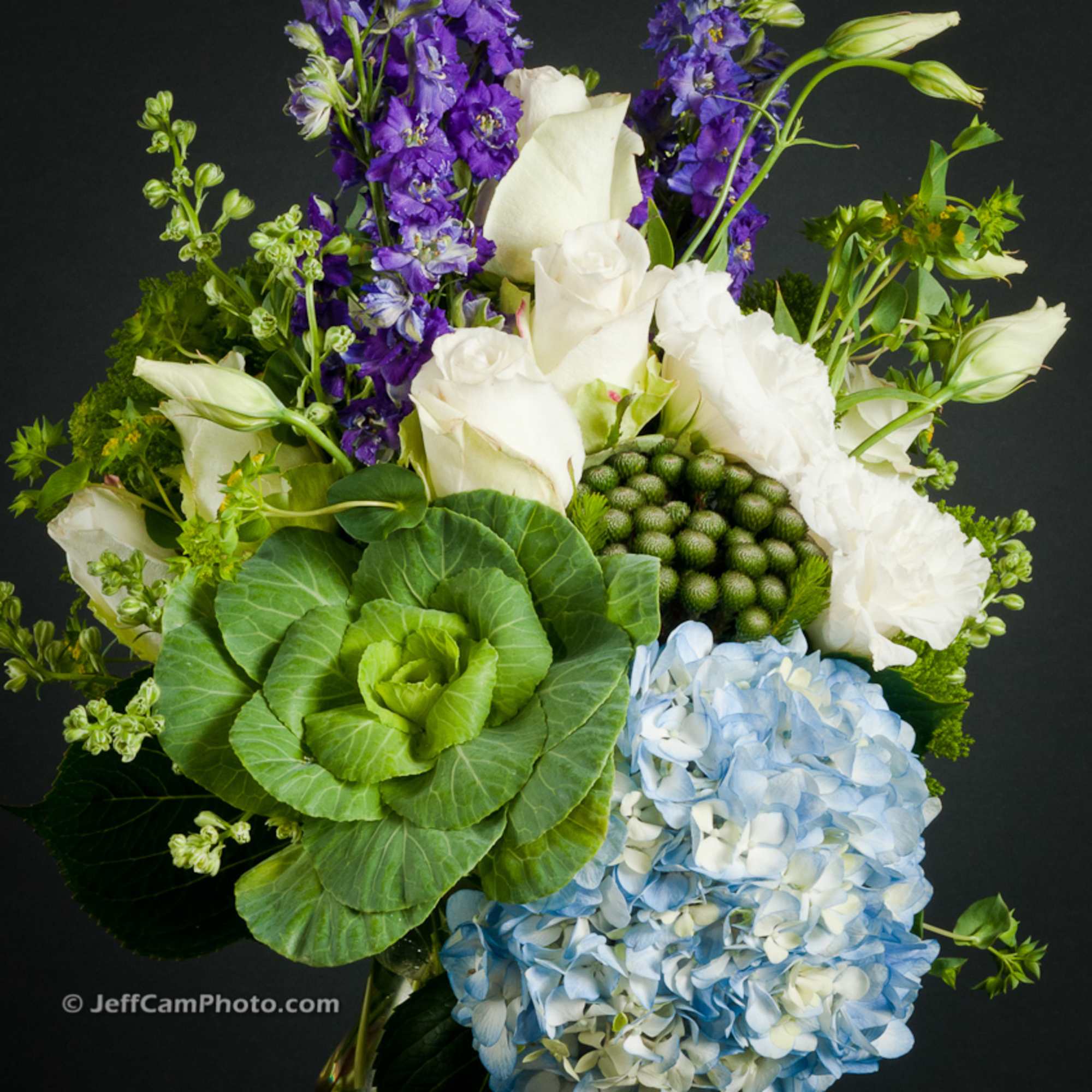 Bouquet with white roses, purple flowers, and blue hydrangea