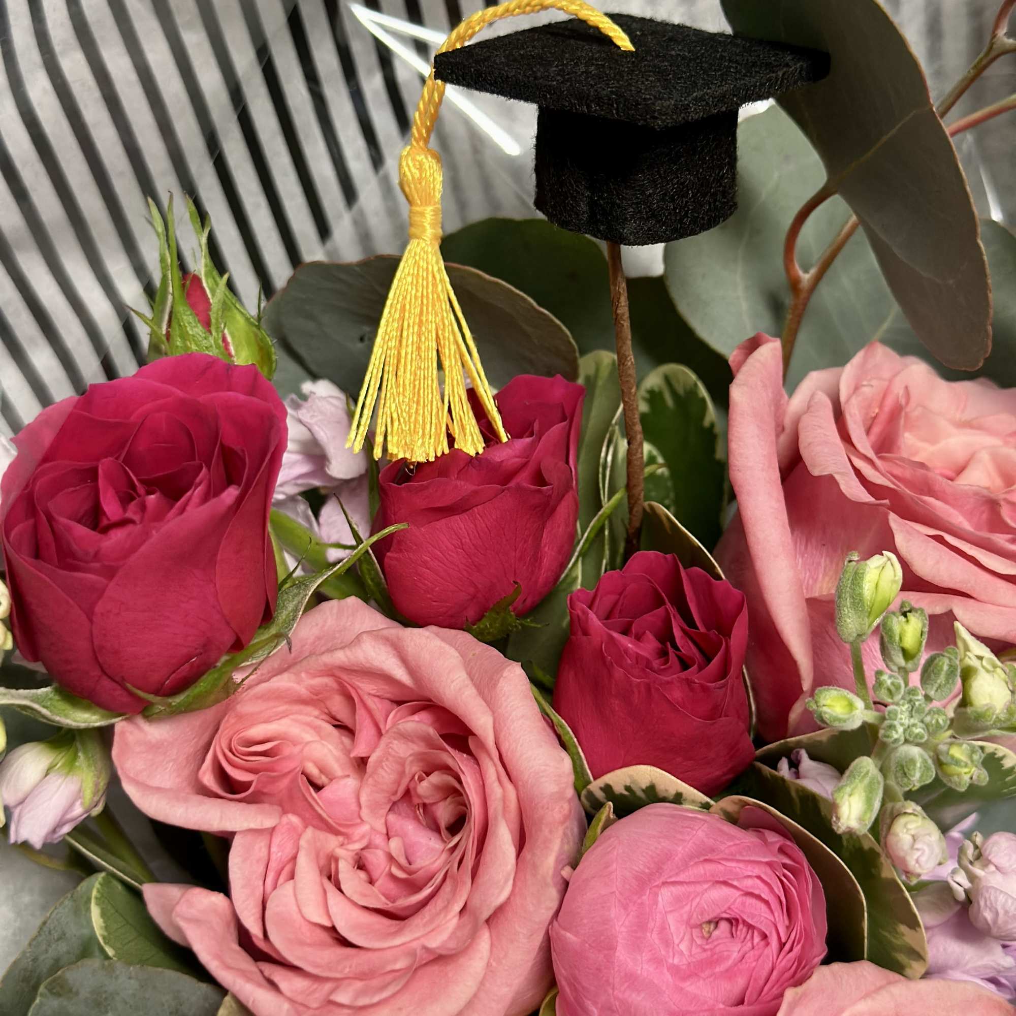 Celebrate your Grad with a pretty paper wrapped bouquet in shades of