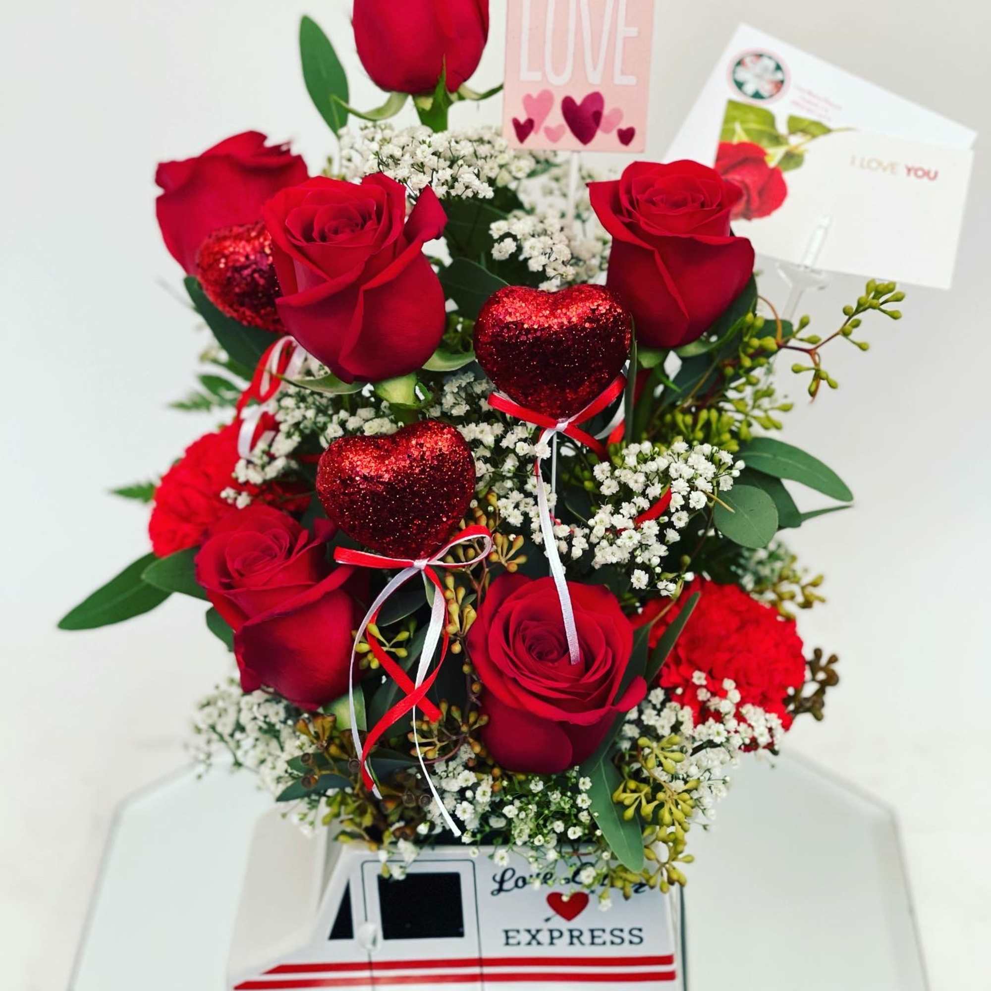 In a cute mail man vase 