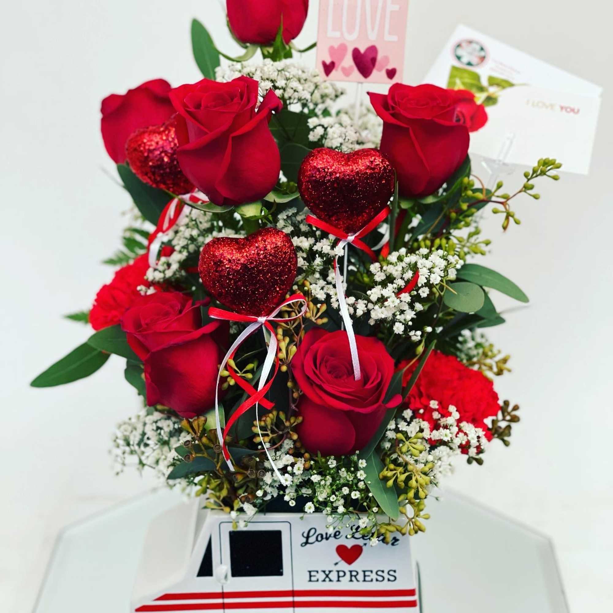 In a cute mail man vase 