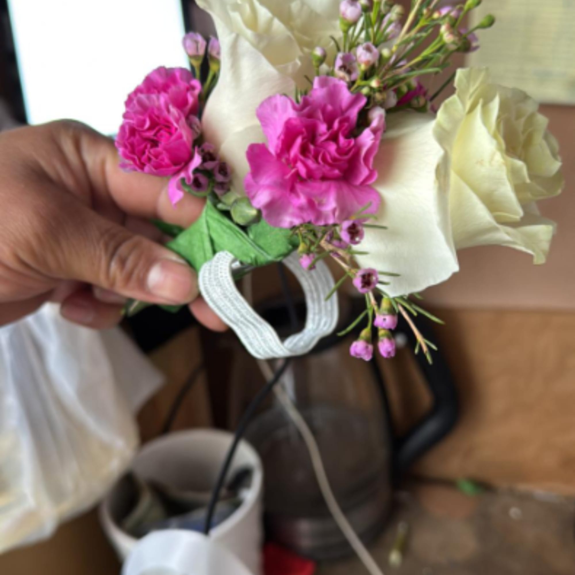Elegant graduation corsage designed with high-quality fresh flowers. Colors and style will