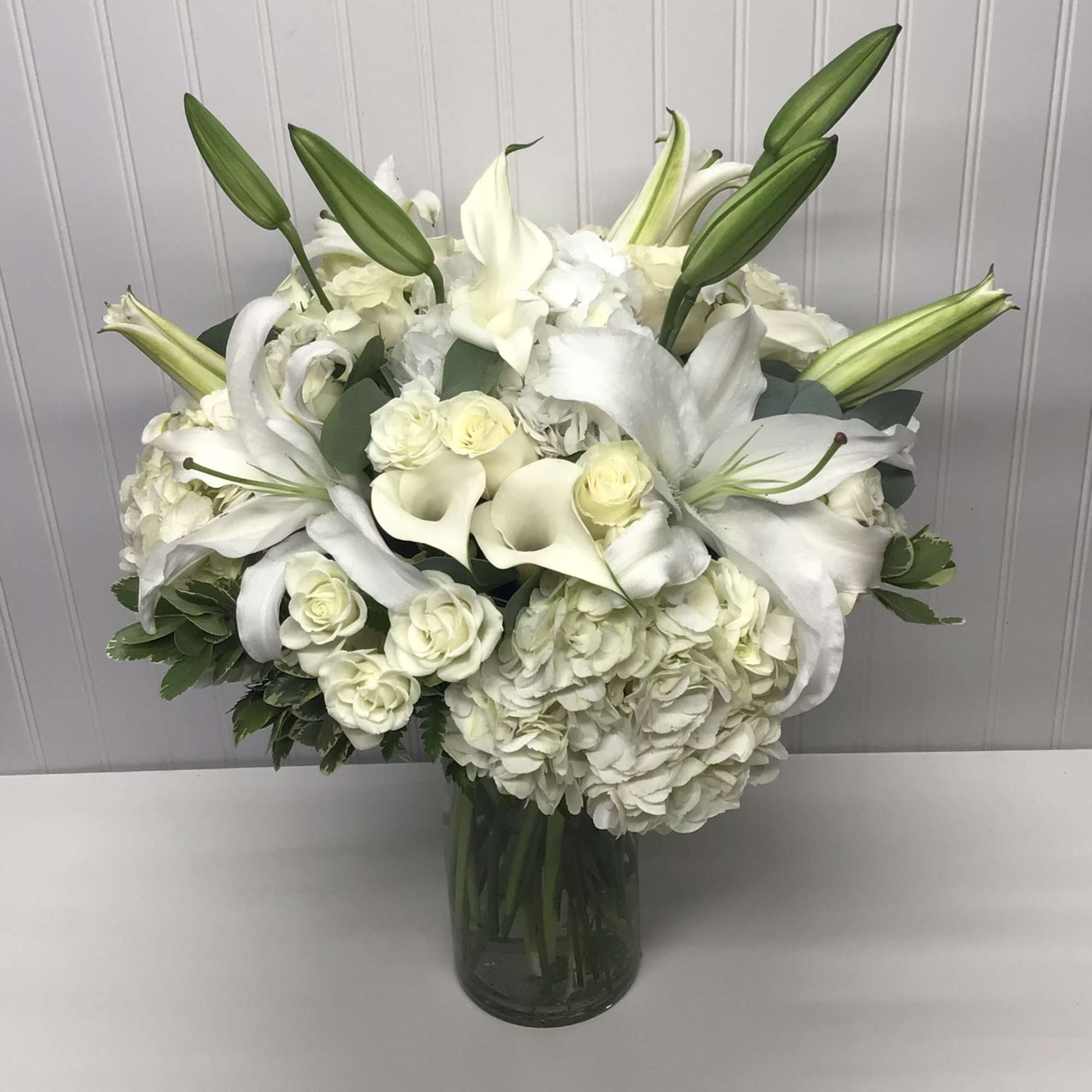 A whisper-quiet affirmation of love. Subtle shadings of  white roses lilies