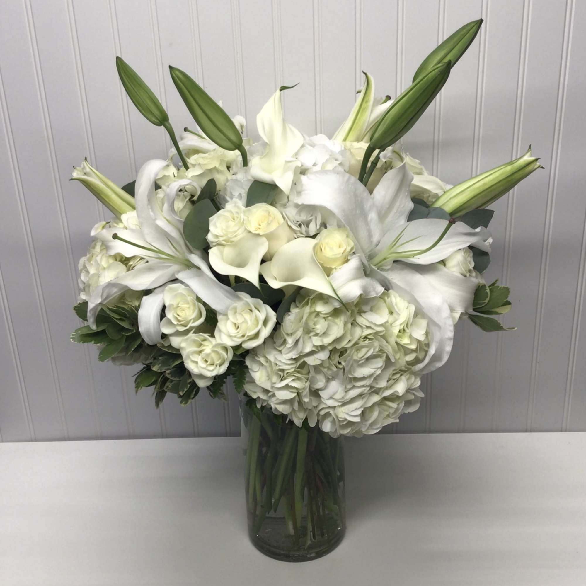 A whisper-quiet affirmation of love. Subtle shadings of  white roses lilies