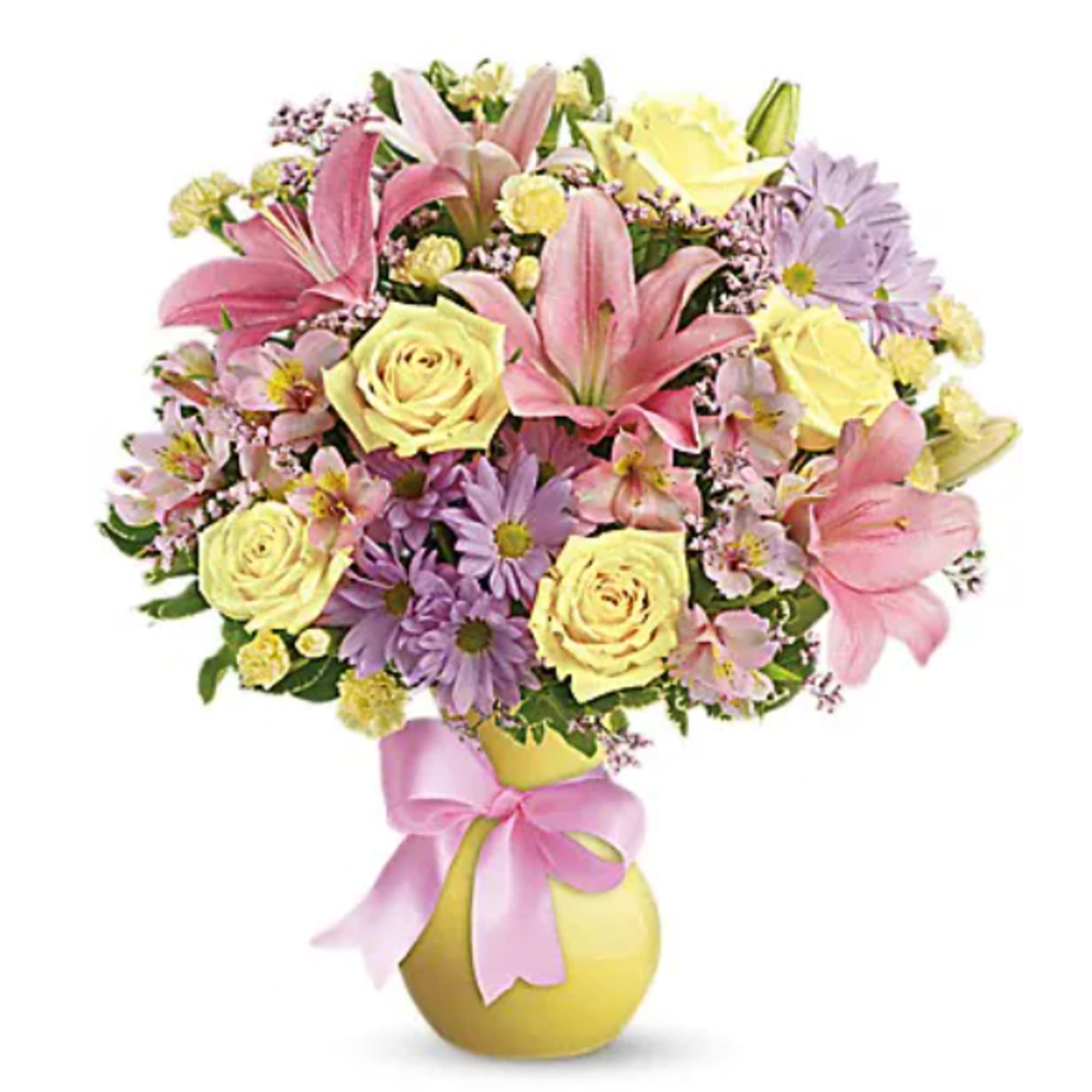 Bouquet of pink lilies, yellow roses, and purple daisies in a yellow vase with a pink ribbon
