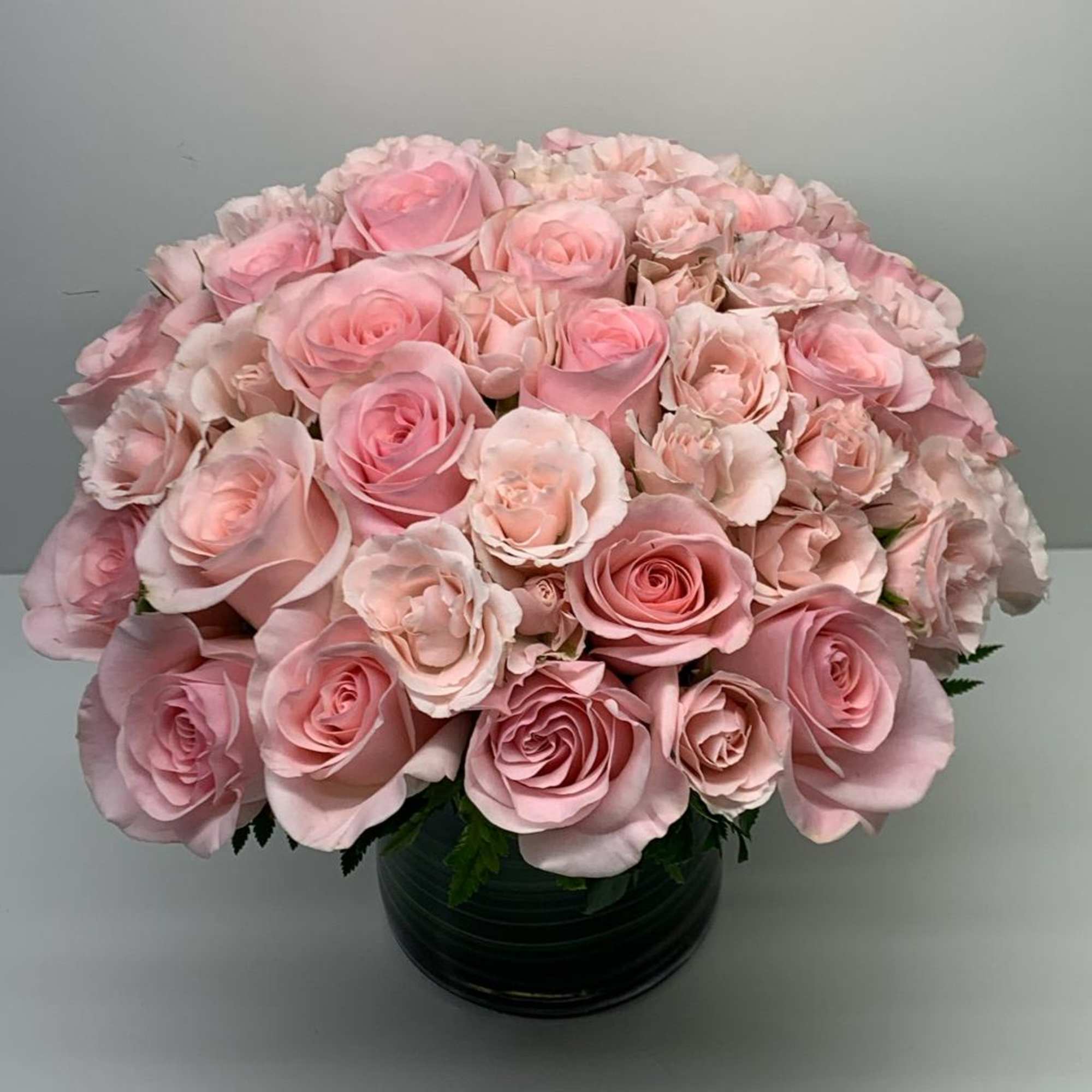 A beautiful arrangement with light pink roses perfect for that special person