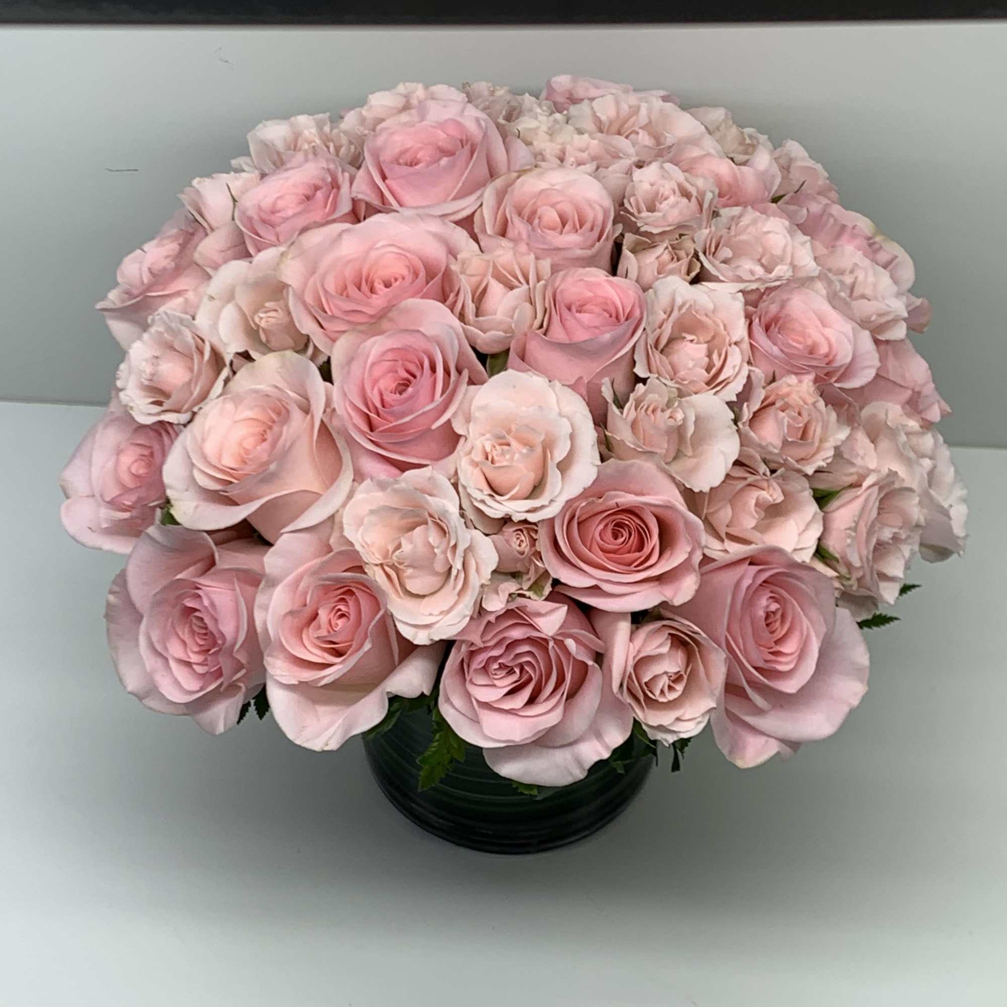 A beautiful arrangement with light pink roses perfect for that special person