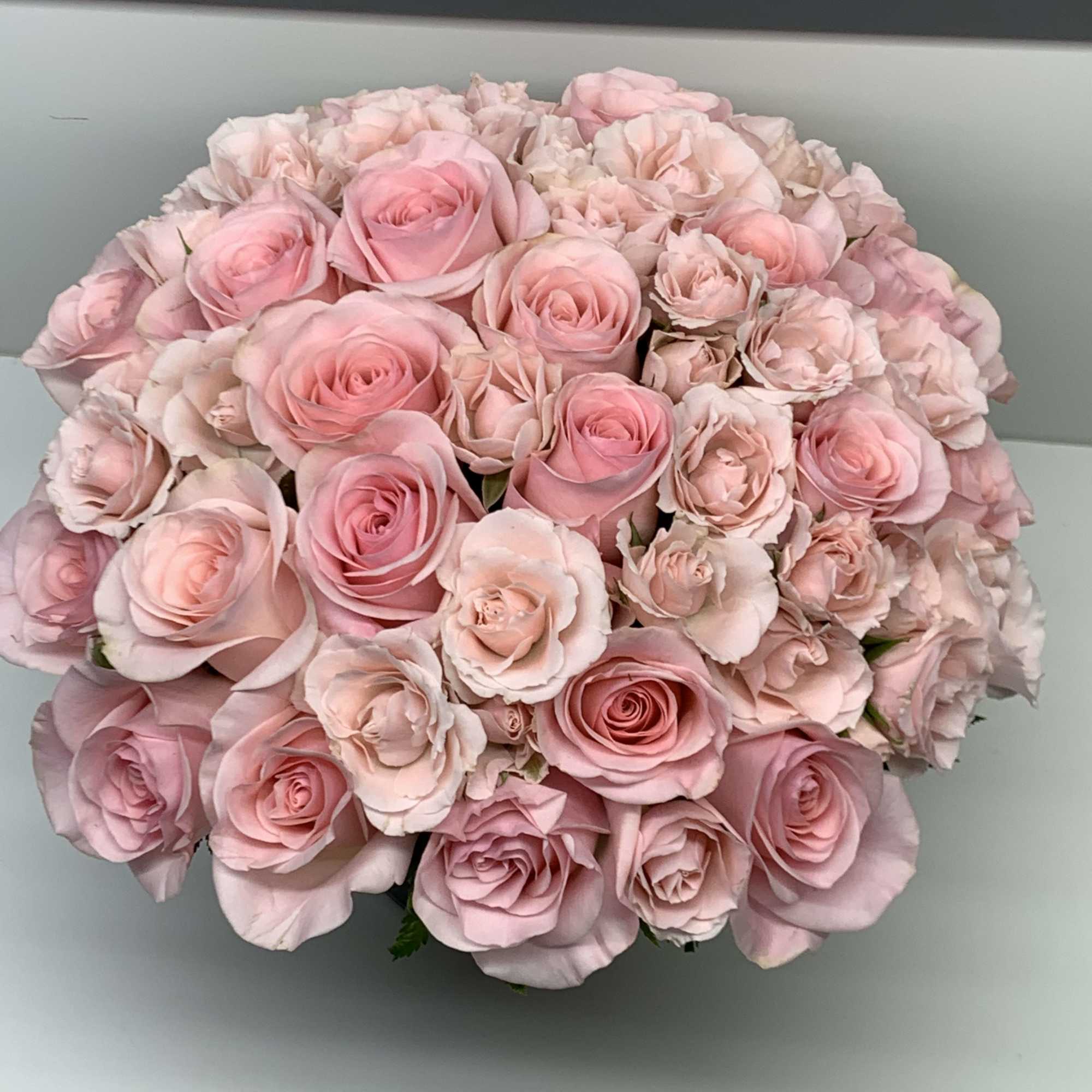 A beautiful arrangement with light pink roses perfect for that special person