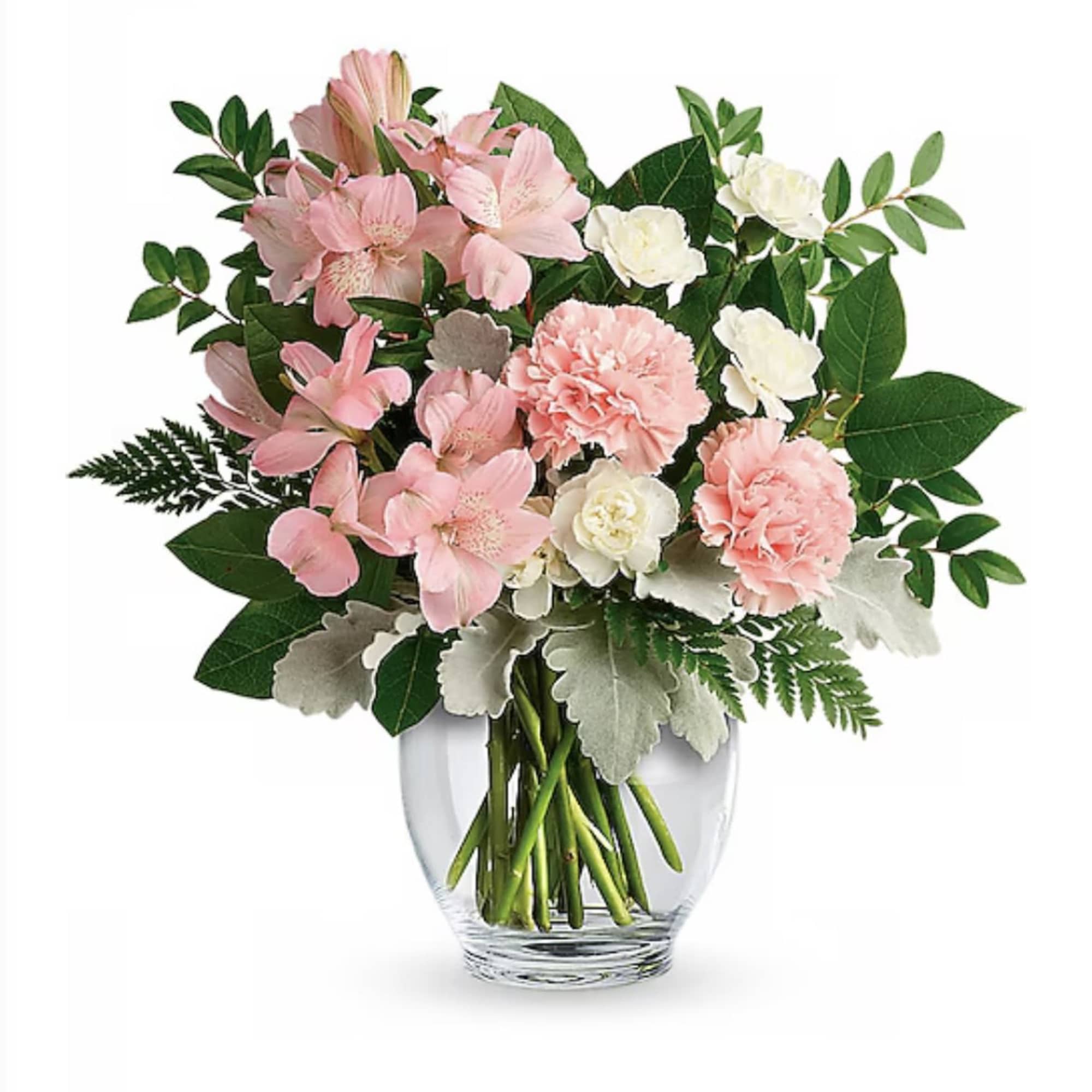 Pink carnations and alstroemeria with white flowers arranged in a clear glass vase