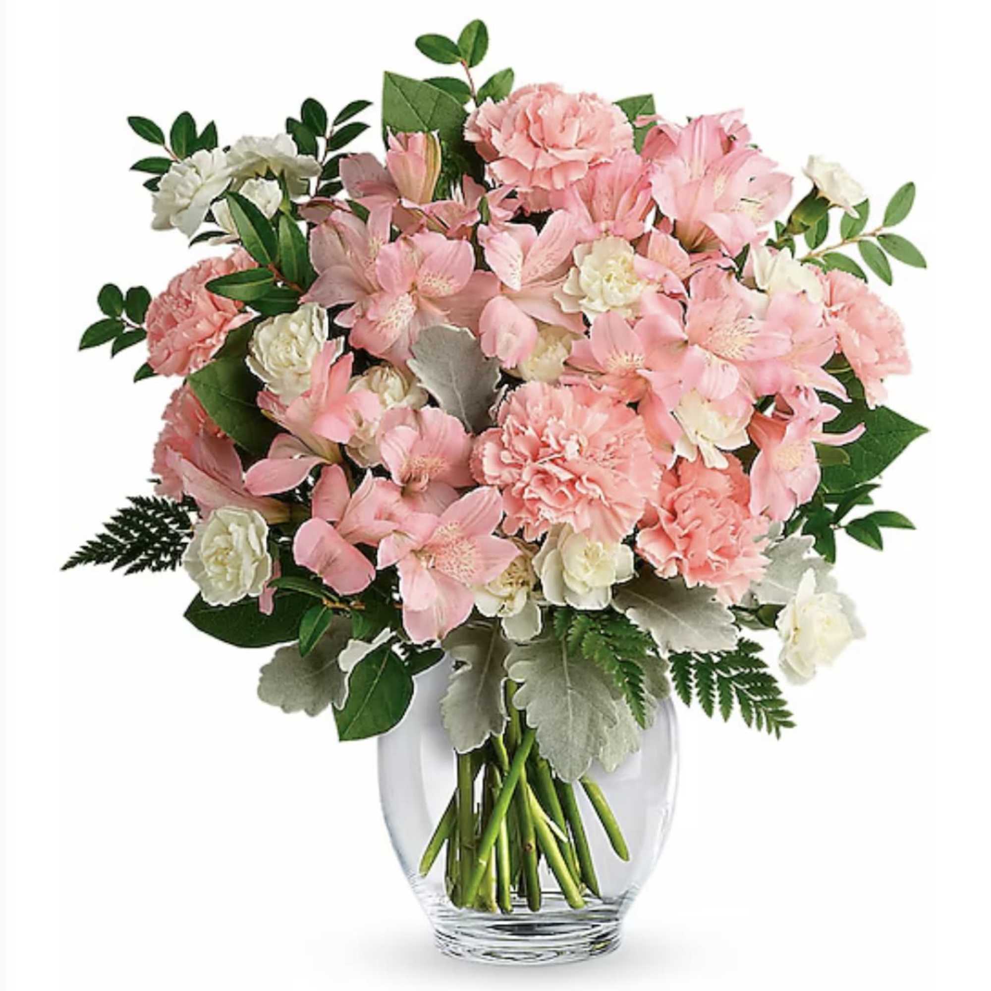 Round bouquet of pink and white flowers in a clear glass vase