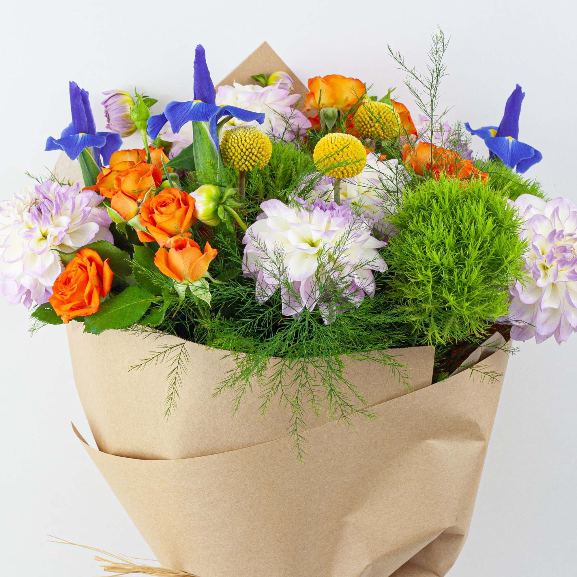 Bouquet of orange and lavender flowers wrapped in brown paper