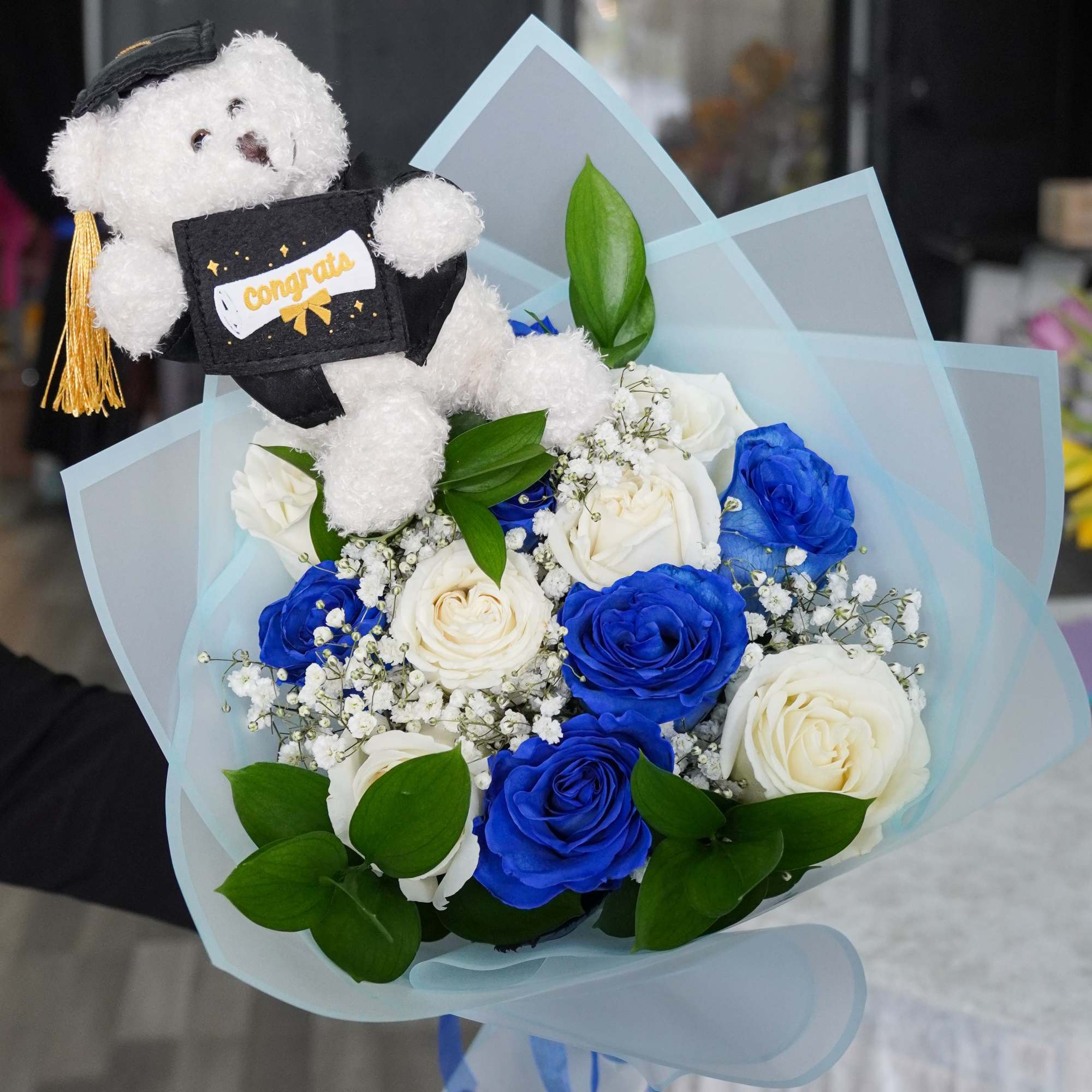 Celebrate their big achievement with our beautiful "Grads Dozen Rose Bouquet" .