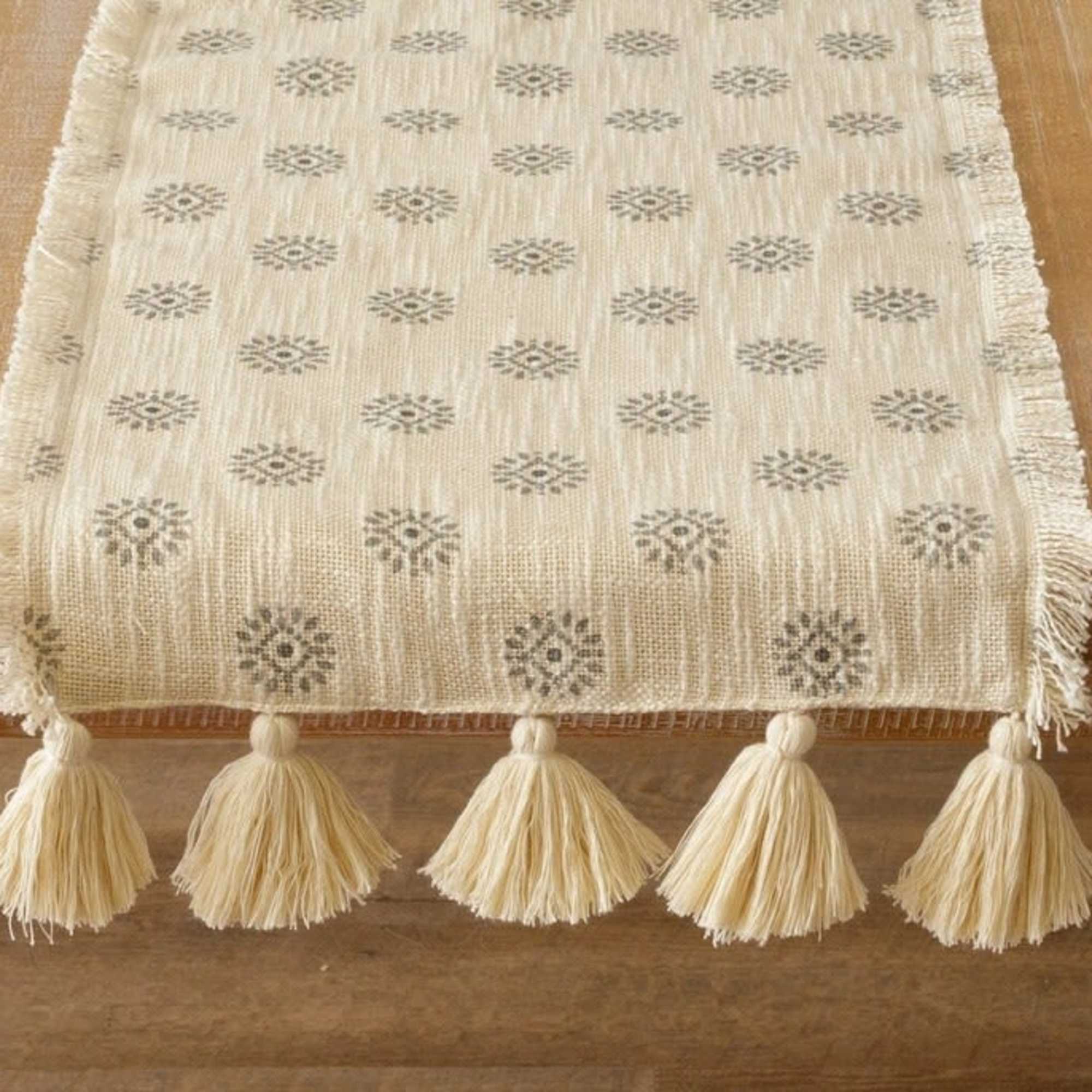 56" x 13" table runner with a medallion pattern