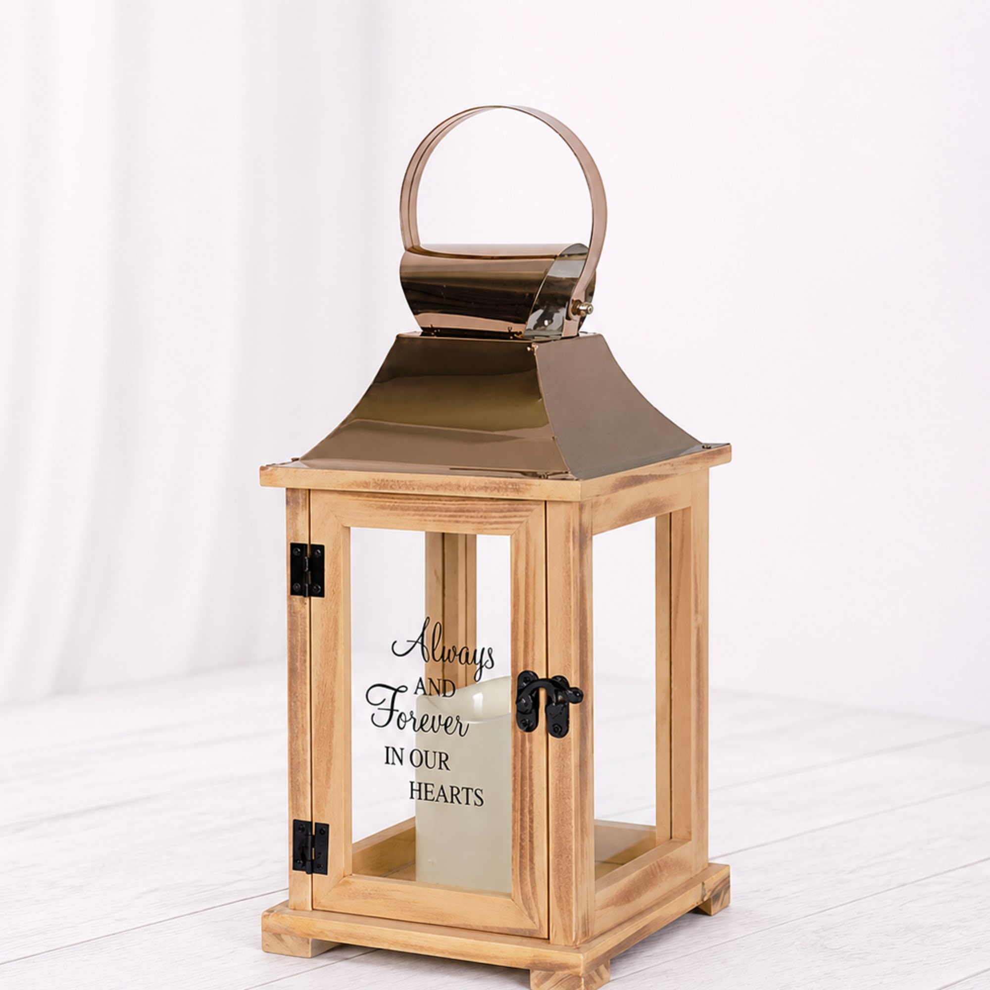 A cream candle in a rustic wooden lantern with copper top and