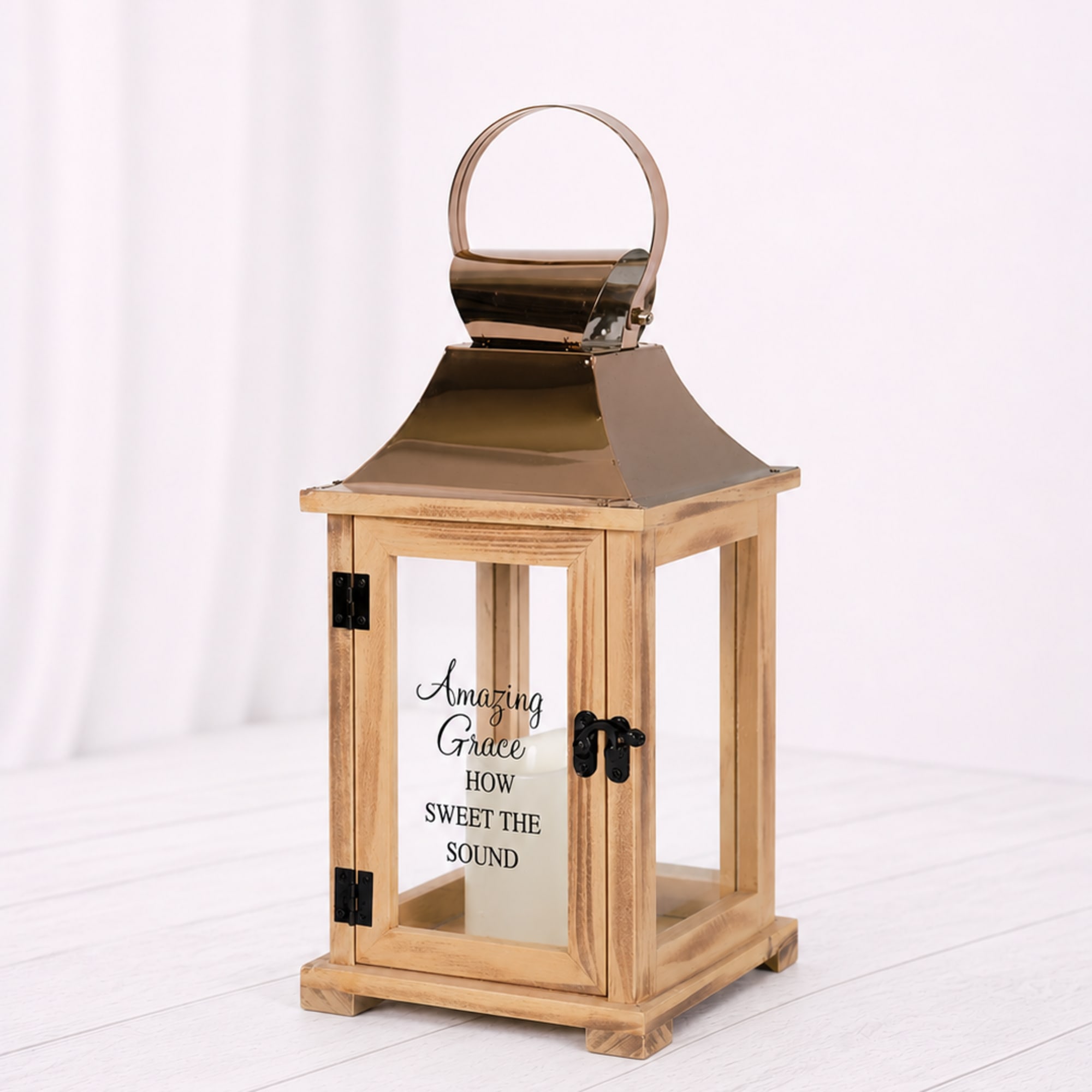 Wooden lantern with a metal top and glass panels