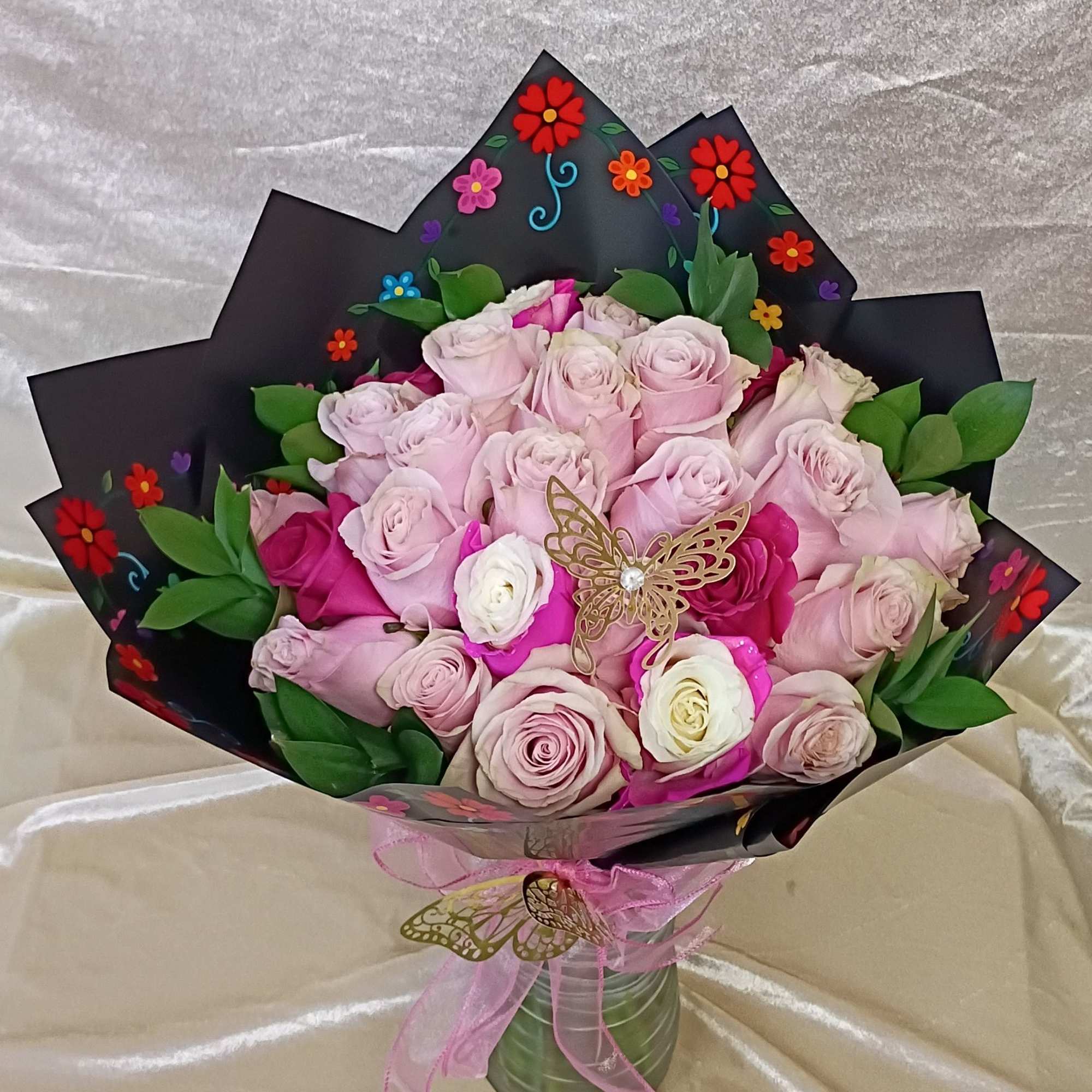 A tightly packed spray of two dozen pink roses creates an immediate