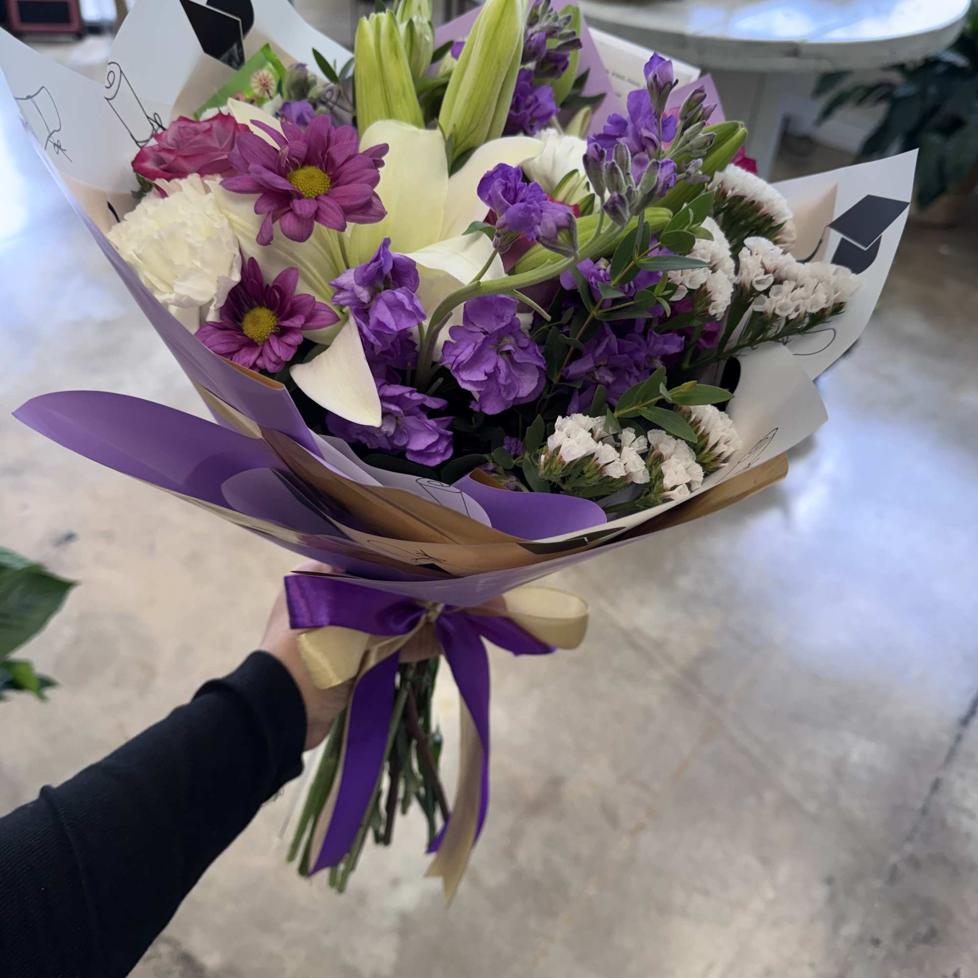 Wrapped bouquets for graduation. These arrangements will be made with a mix