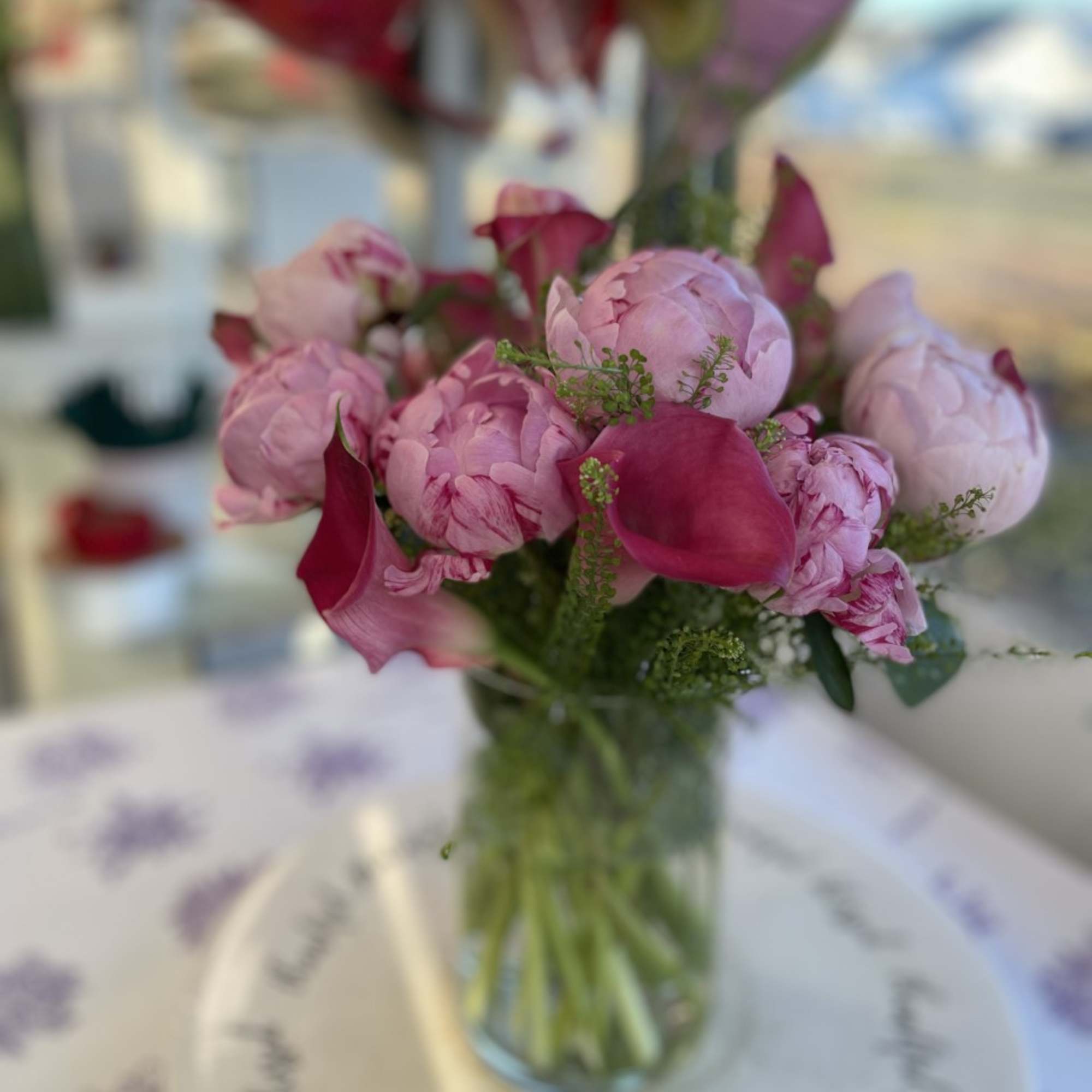 An Incredible arrangement of Pink Peonies and Pink Callas arranged in a