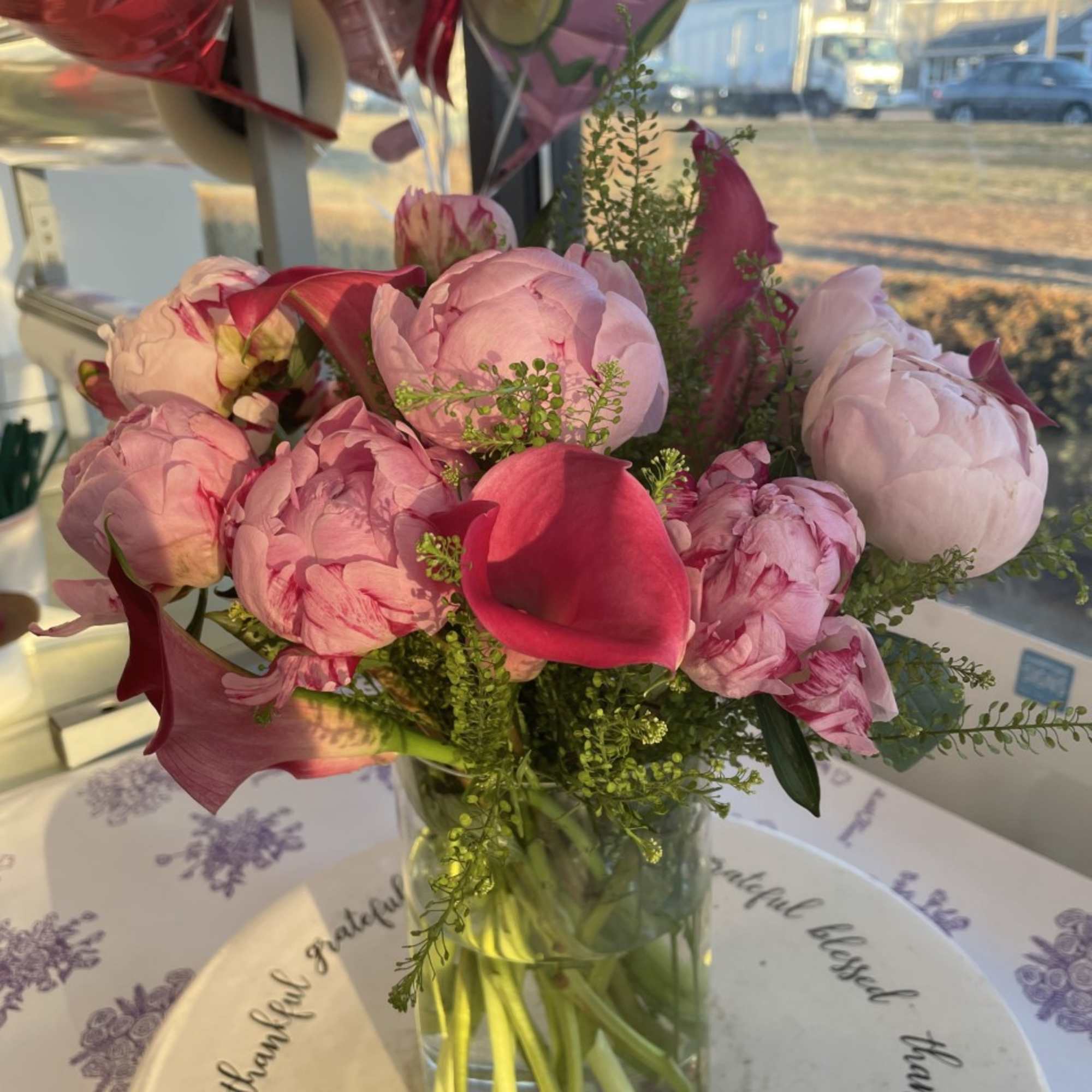 An Incredible arrangement of Pink Peonies and Pink Callas arranged in a
