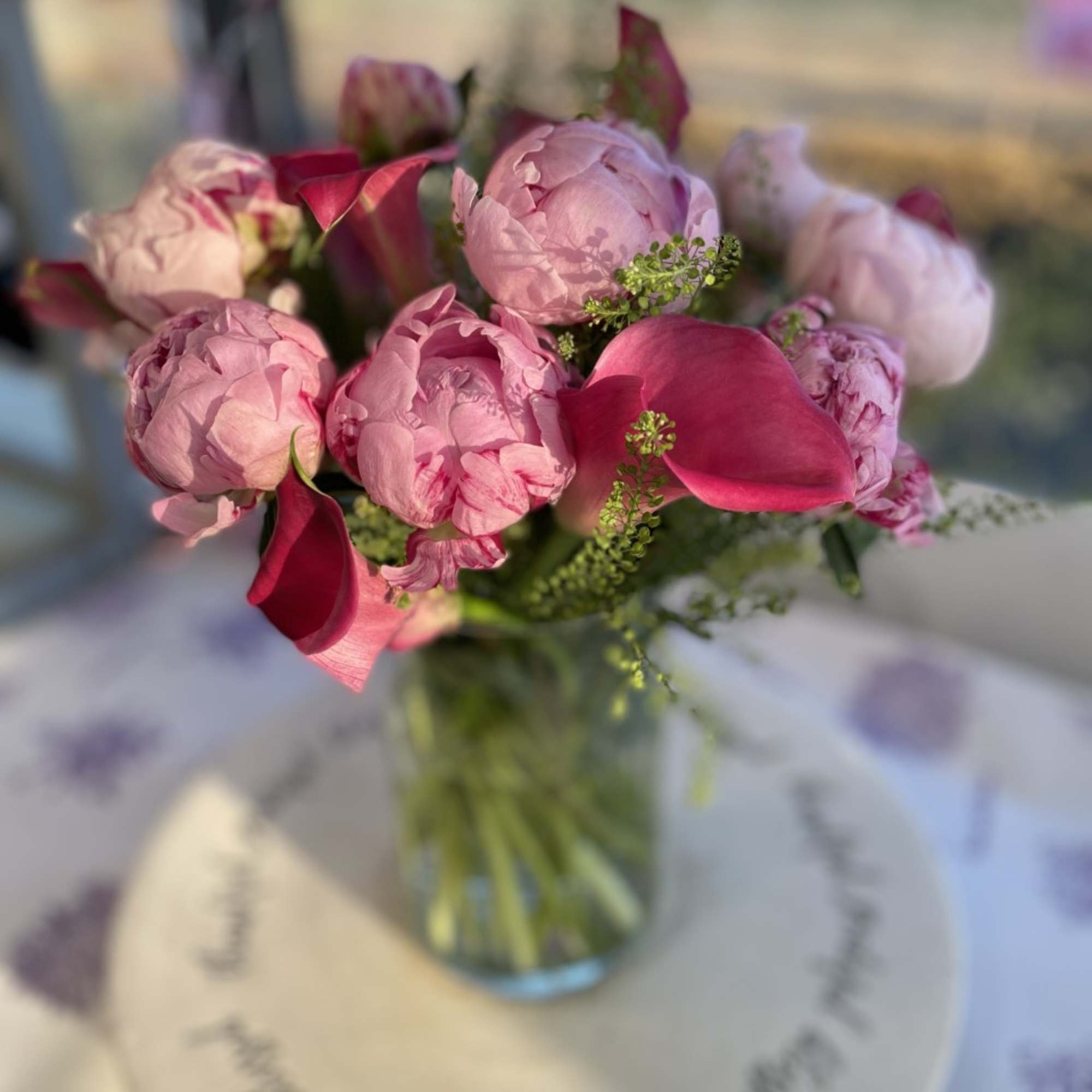 An Incredible arrangement of Pink Peonies and Pink Callas arranged in a