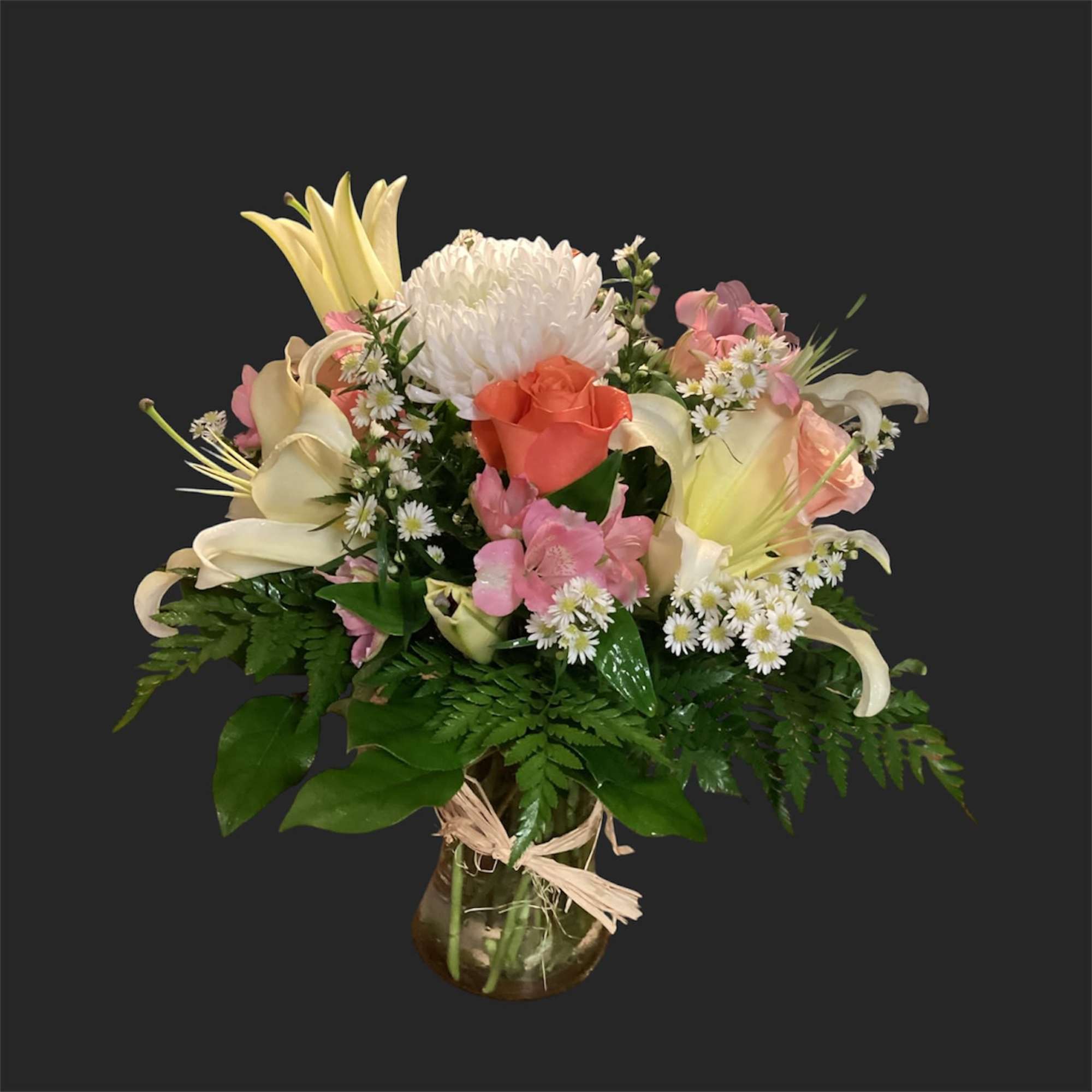 Pink lilies arching above a rounded teacup vase set the tone for