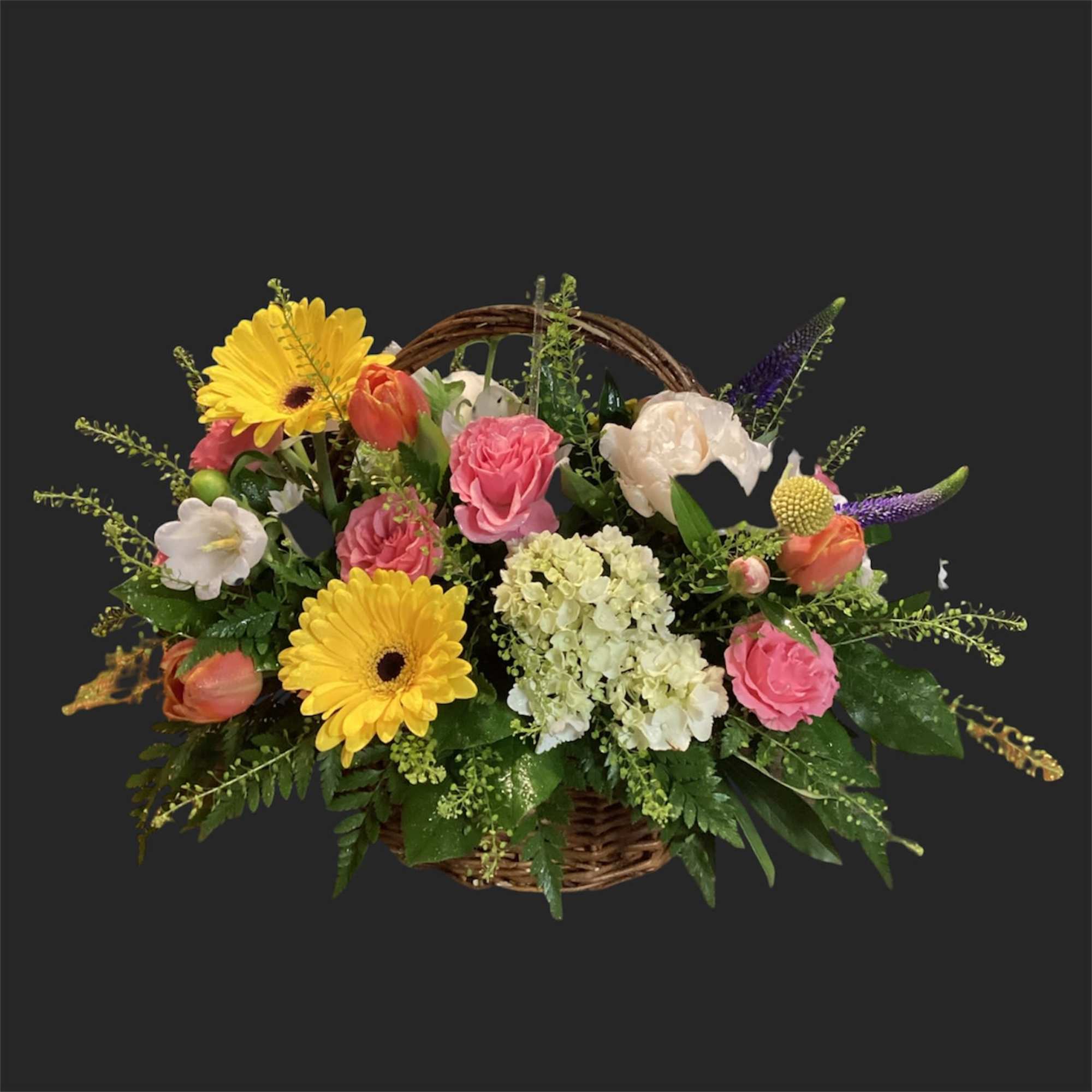 Pink lilies arching above a rounded teacup vase set the tone for