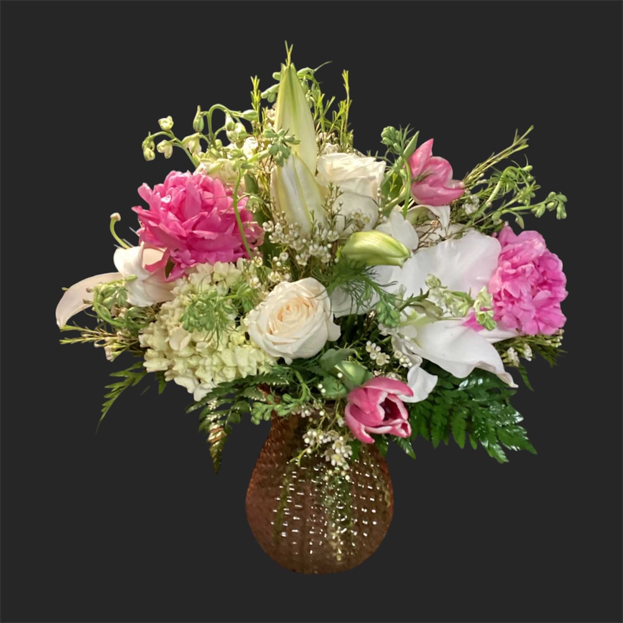 A lively, ever-changing bouquet that surprises with garden-fresh personality-this designer's choice exquisite