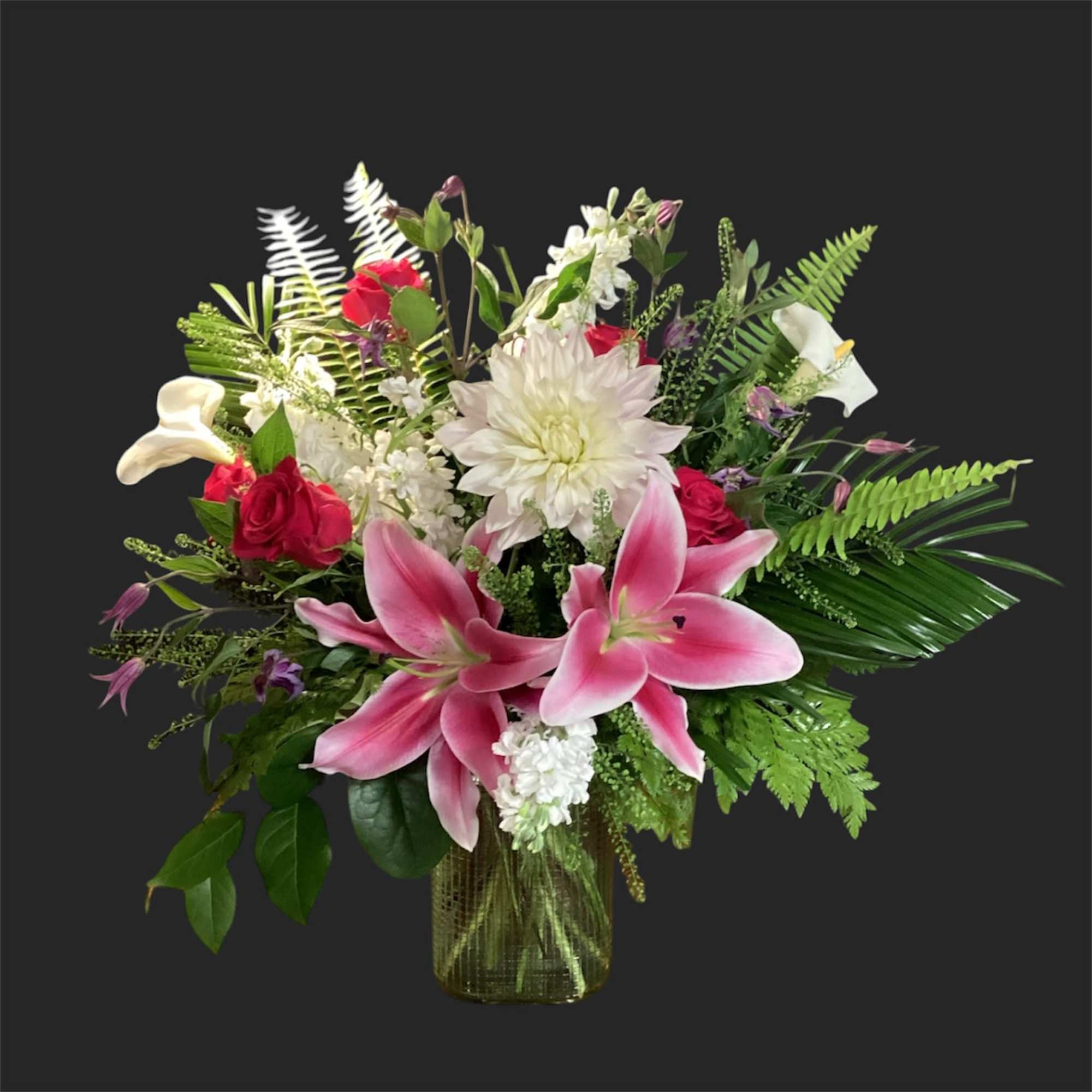 A lively, ever-changing bouquet that surprises with garden-fresh personality-this designer's choice exquisite