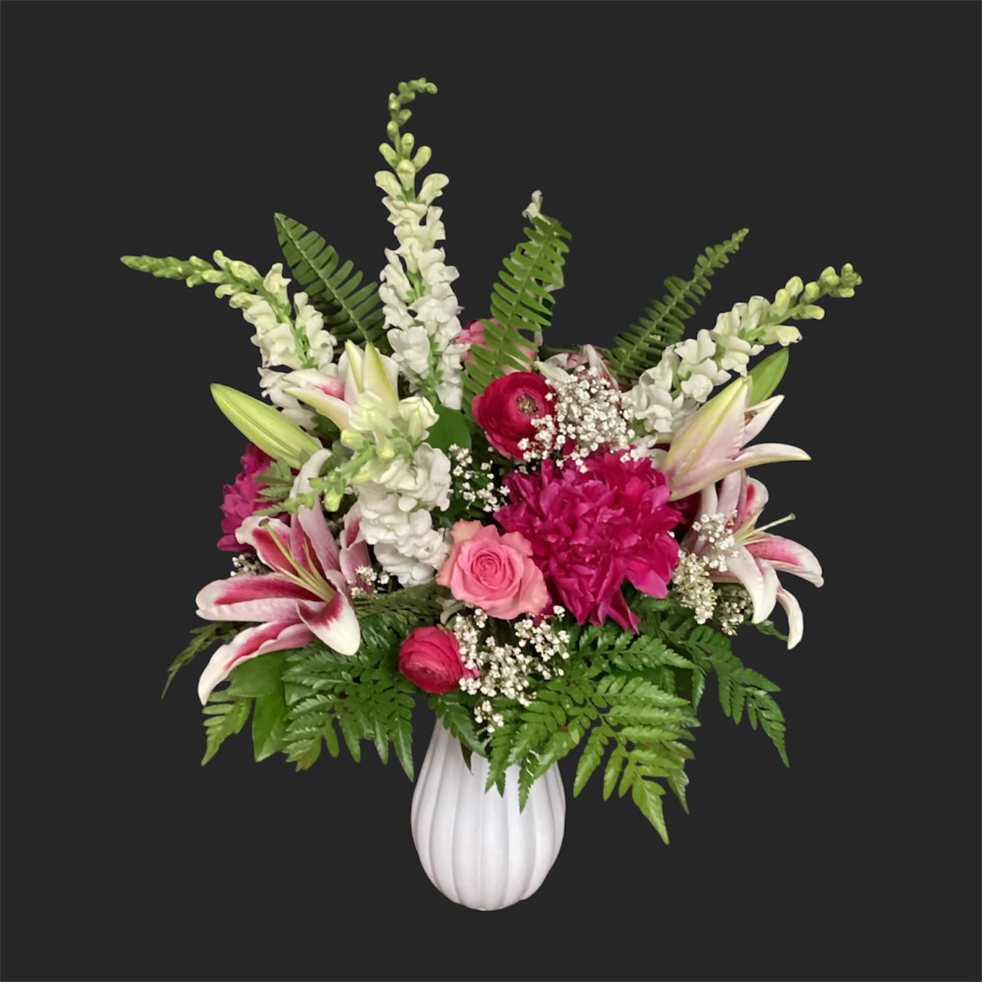 A lively, ever-changing bouquet that surprises with garden-fresh personality-this designer's choice exquisite