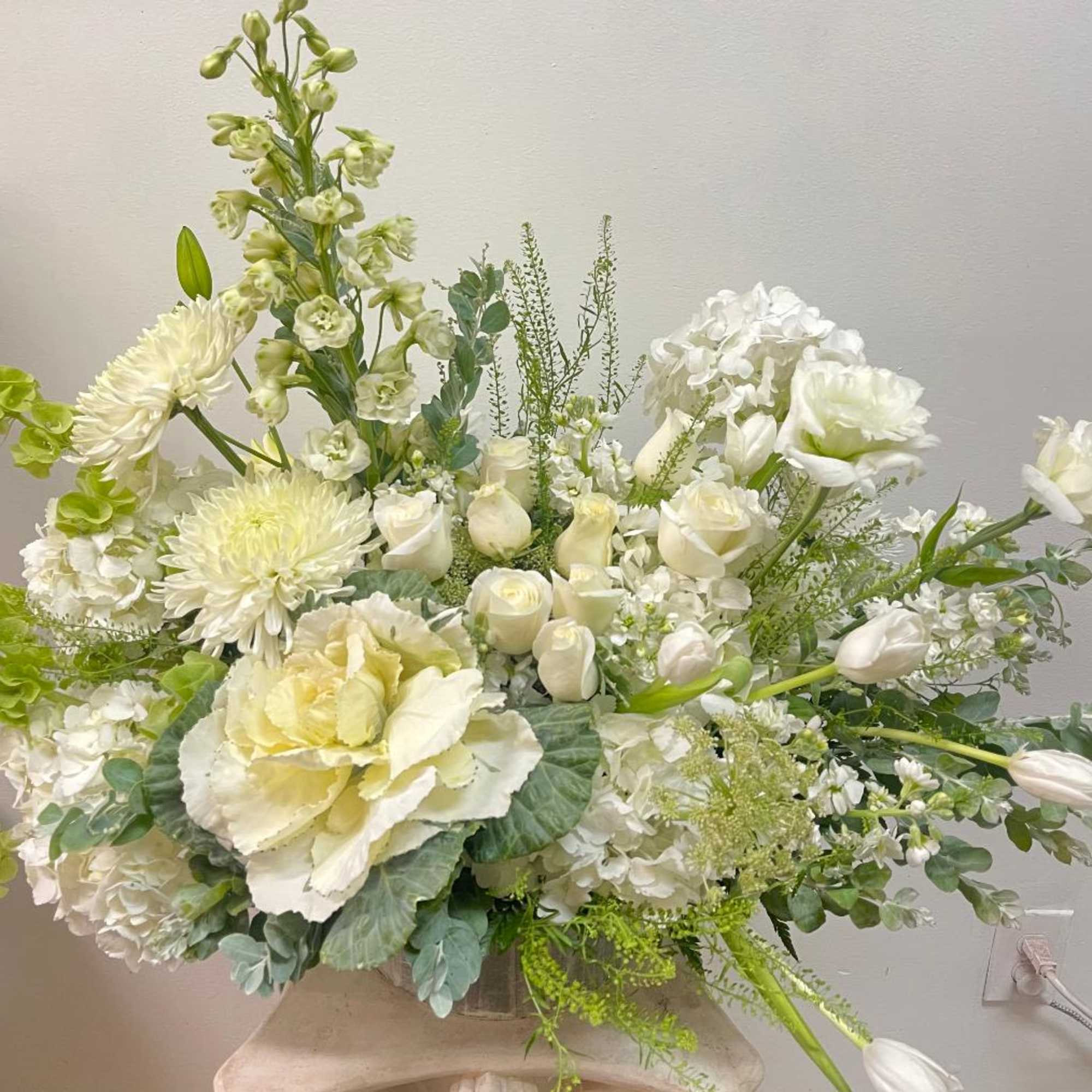 Theme Colors: Shades of White, and Green

Featured Blooms: Roses, Tulips, Cabbage, Delphinium