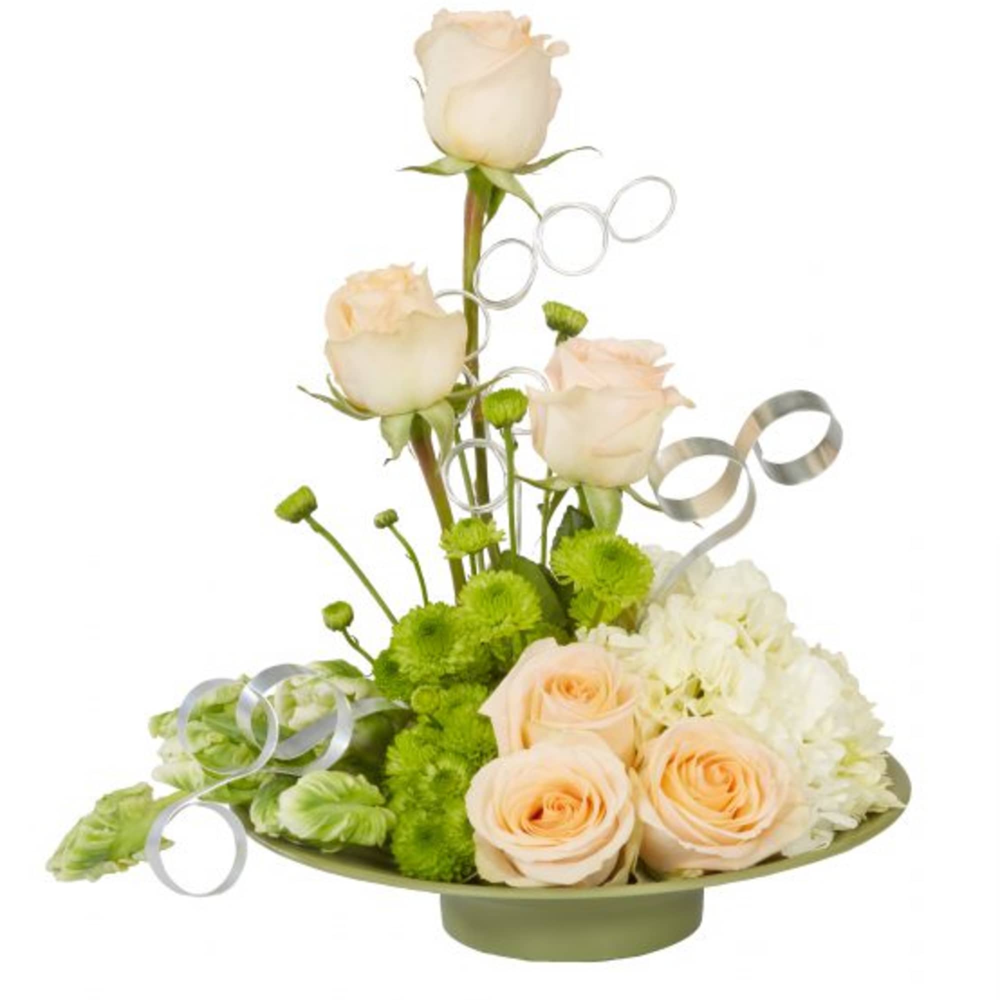 Peach roses and green pompons arranged in a low dish with silver ribbon loops