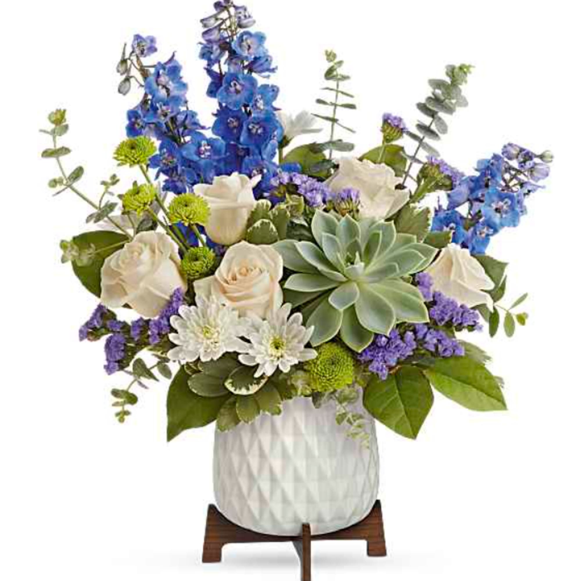 Tall blue delphinium spikes rise above a soft cloud of white daisies