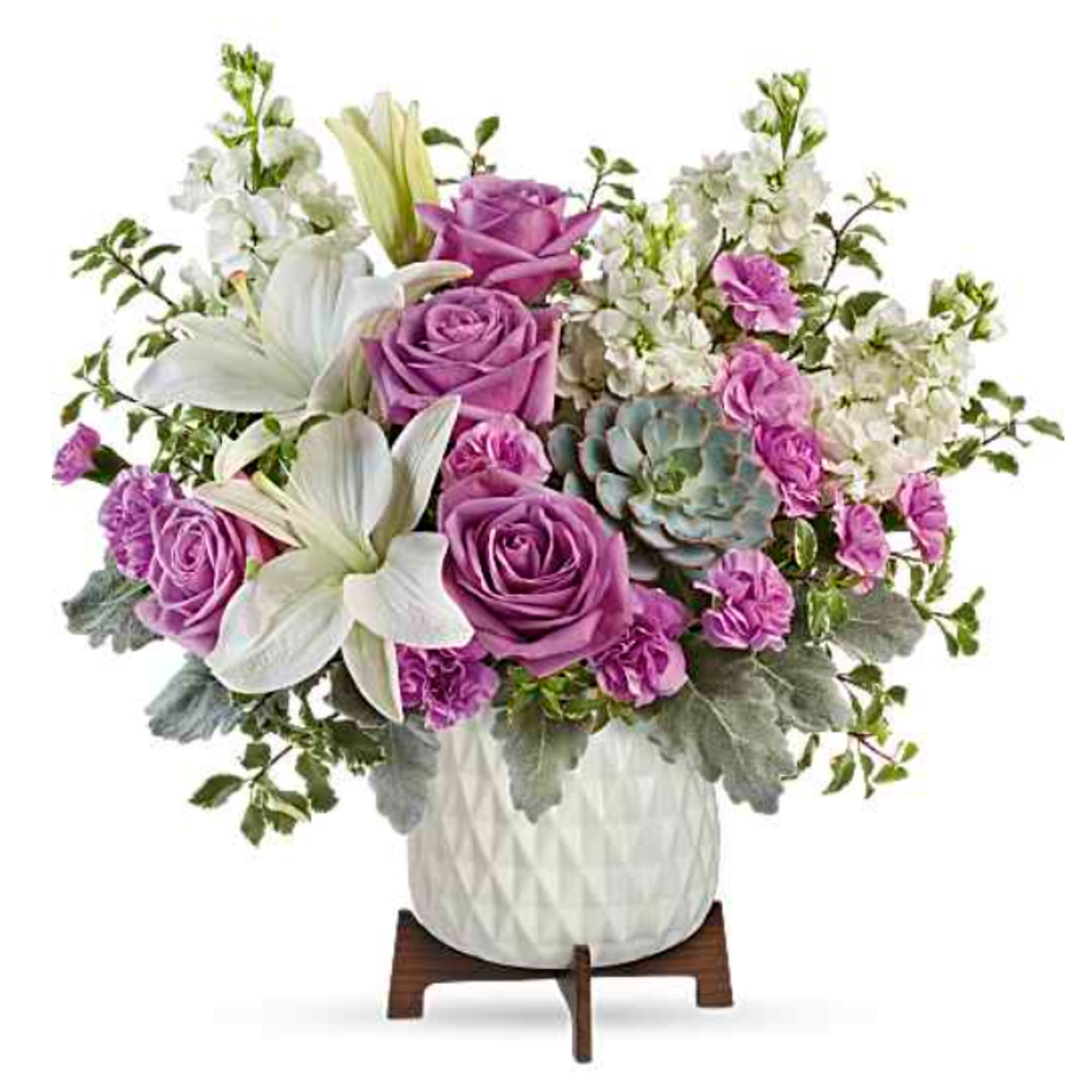 Soft lavender roses and large white lilies create a calm, contemporary statement