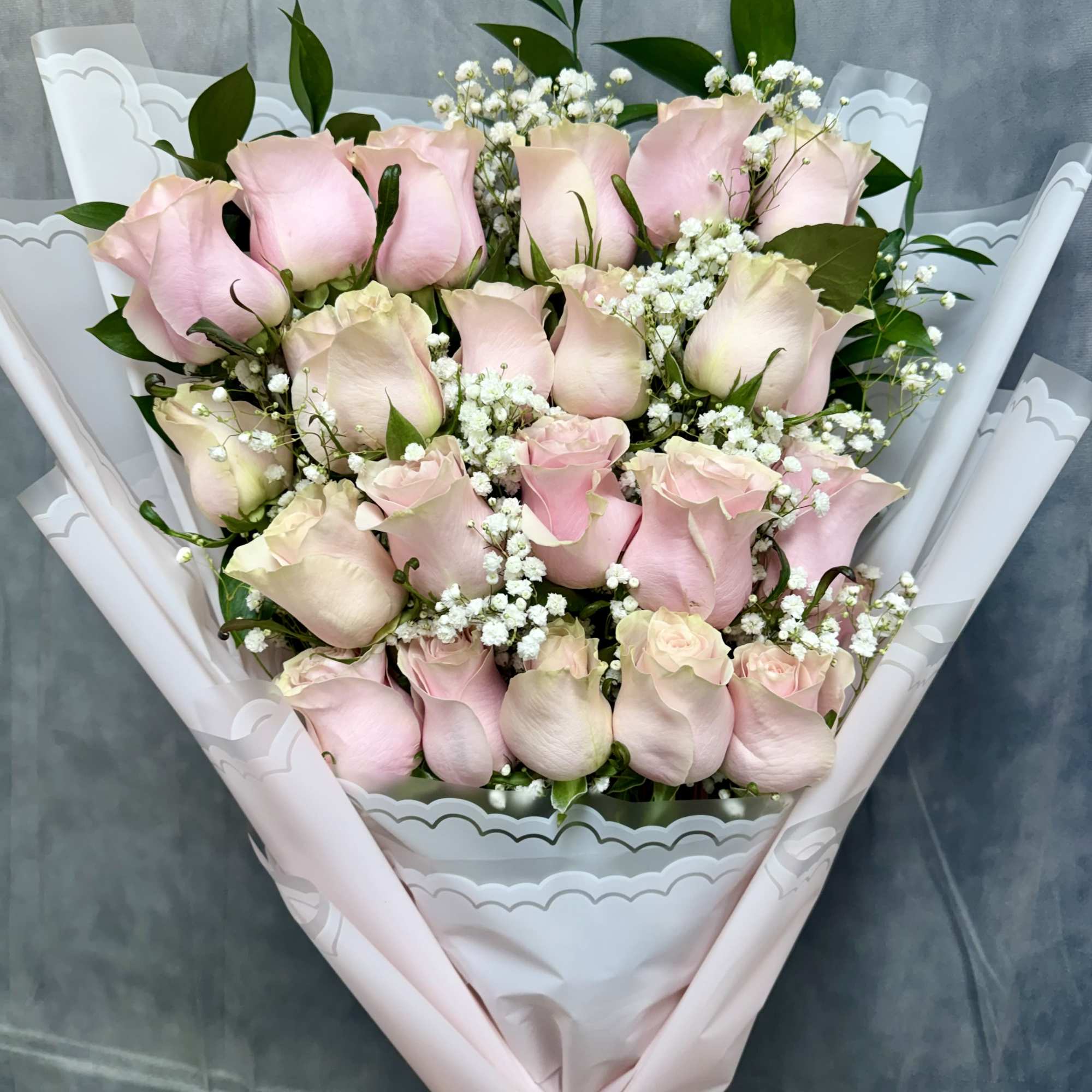 The pink roses bouquet is a charming and elegant floral arrangement featuring