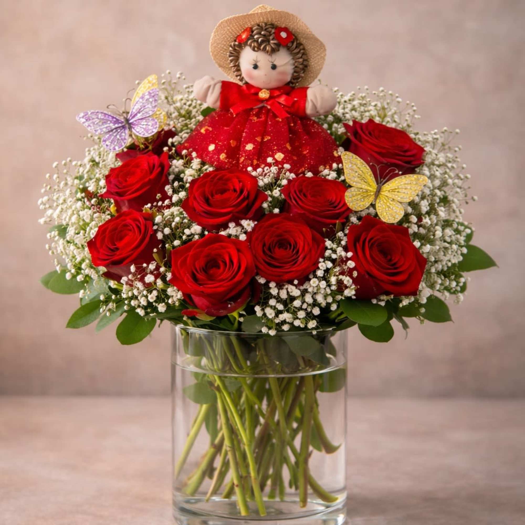 A romantic arrangement of fresh roses accented with delicate butterflies and a