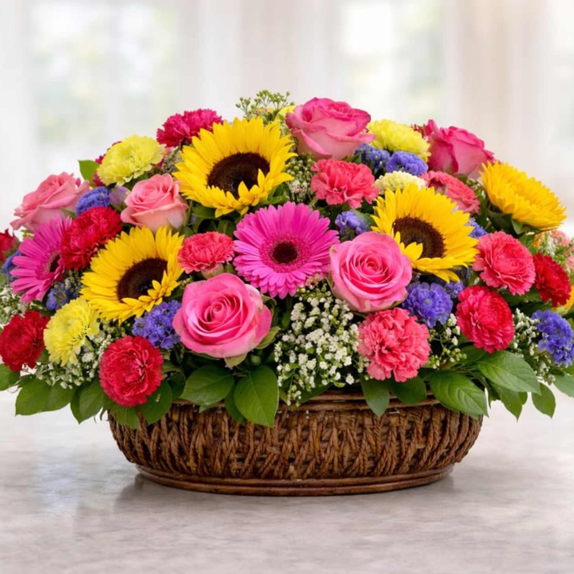 Bright, cheerful, and full of color, this stunning basket arrangement is designed