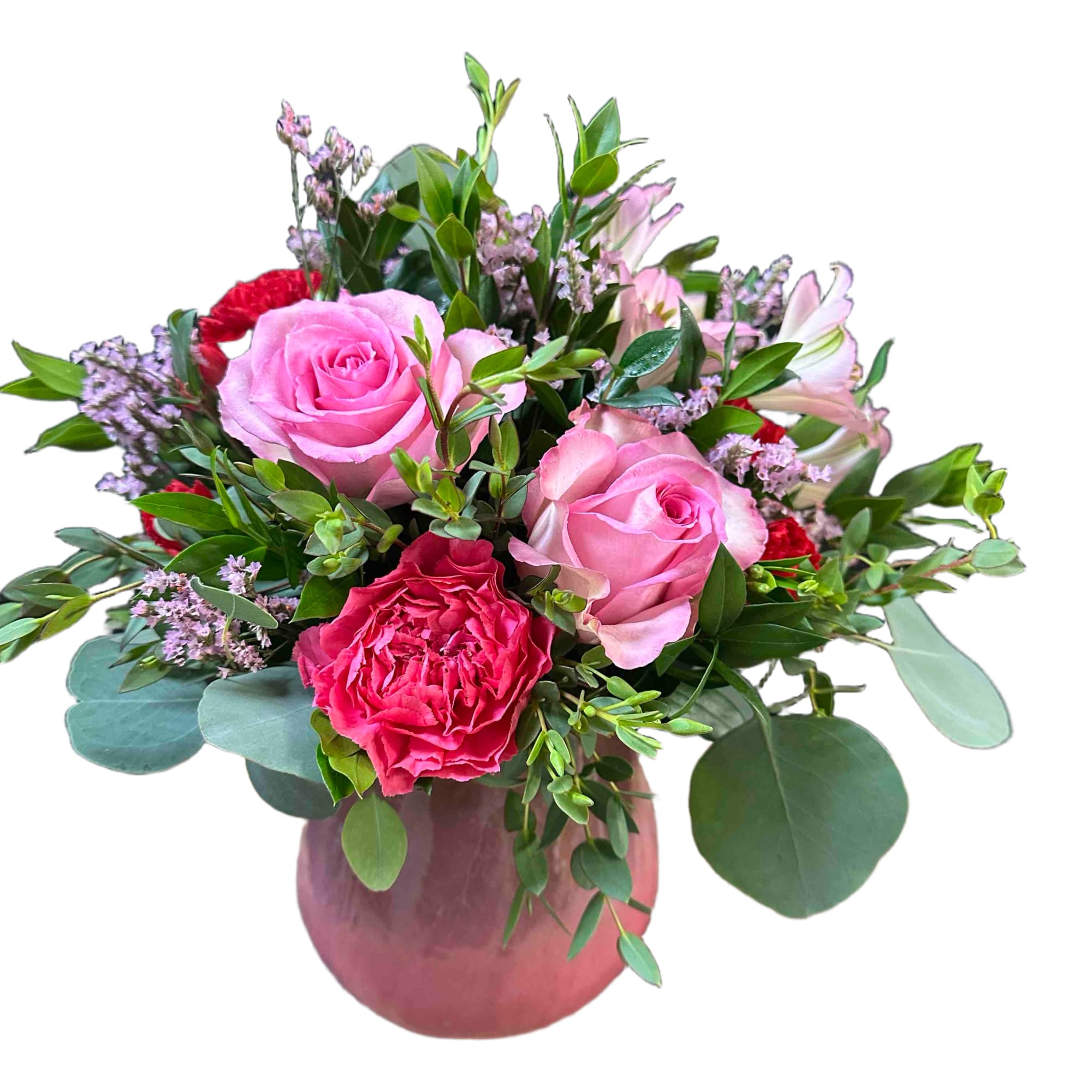 Pink roses, hot pink carnation, lavender filler, pink alstromeria, and greenery arranged
