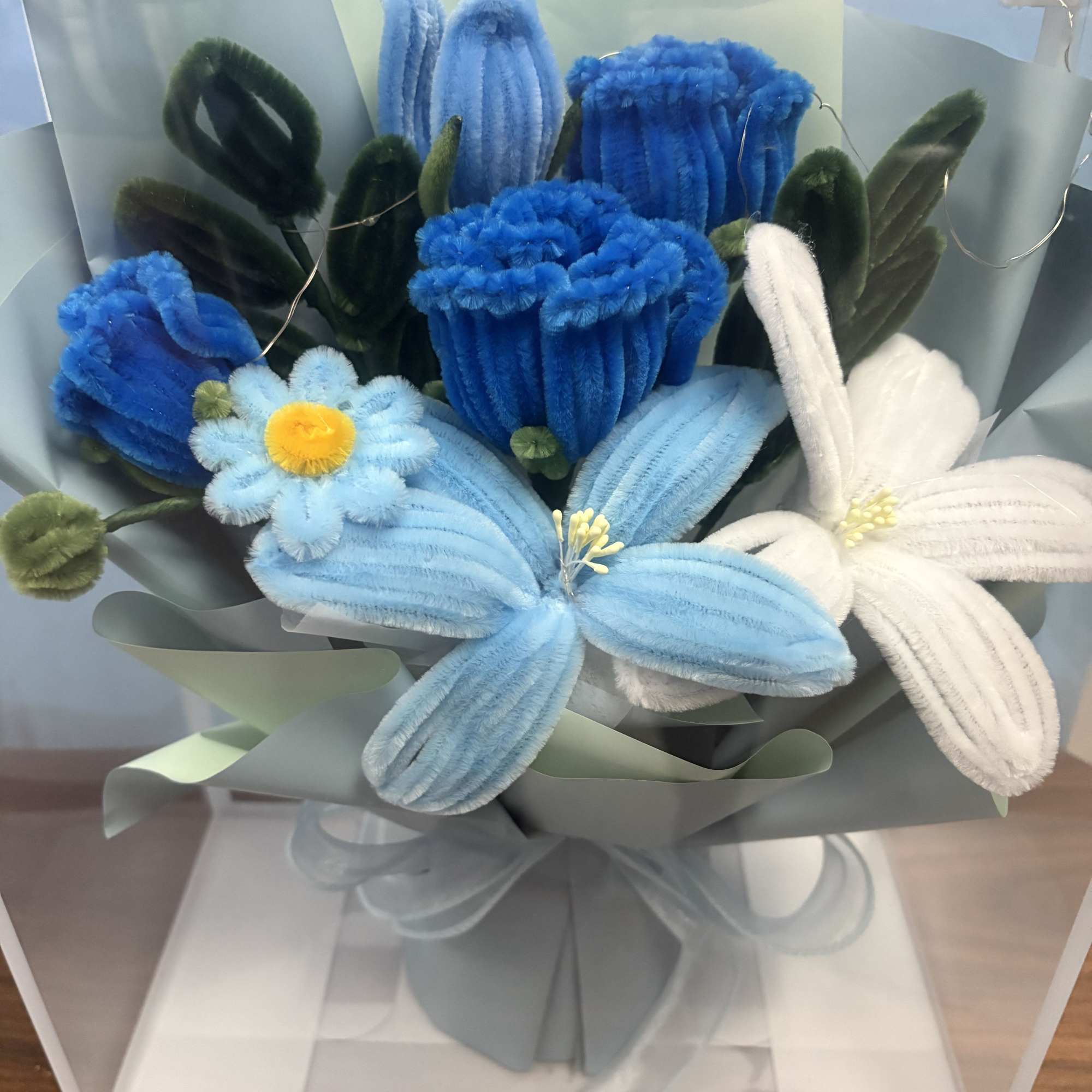 Soft, playful chenille blooms make this blue bouquet an ideal everyday gift