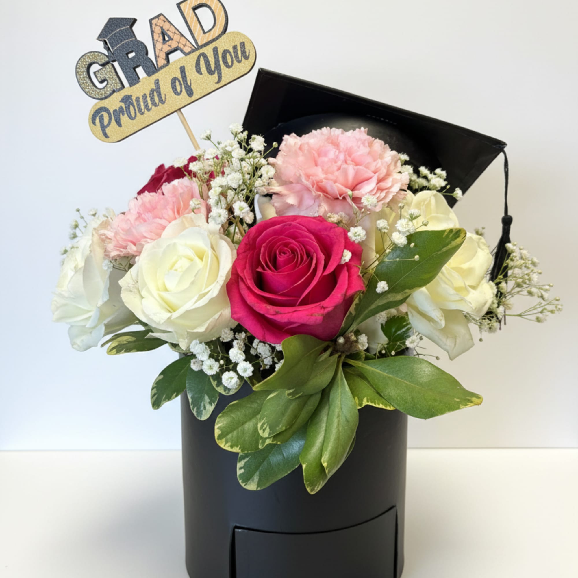 Celebrate your graduate with a lovely arrangement set to signify a worthy