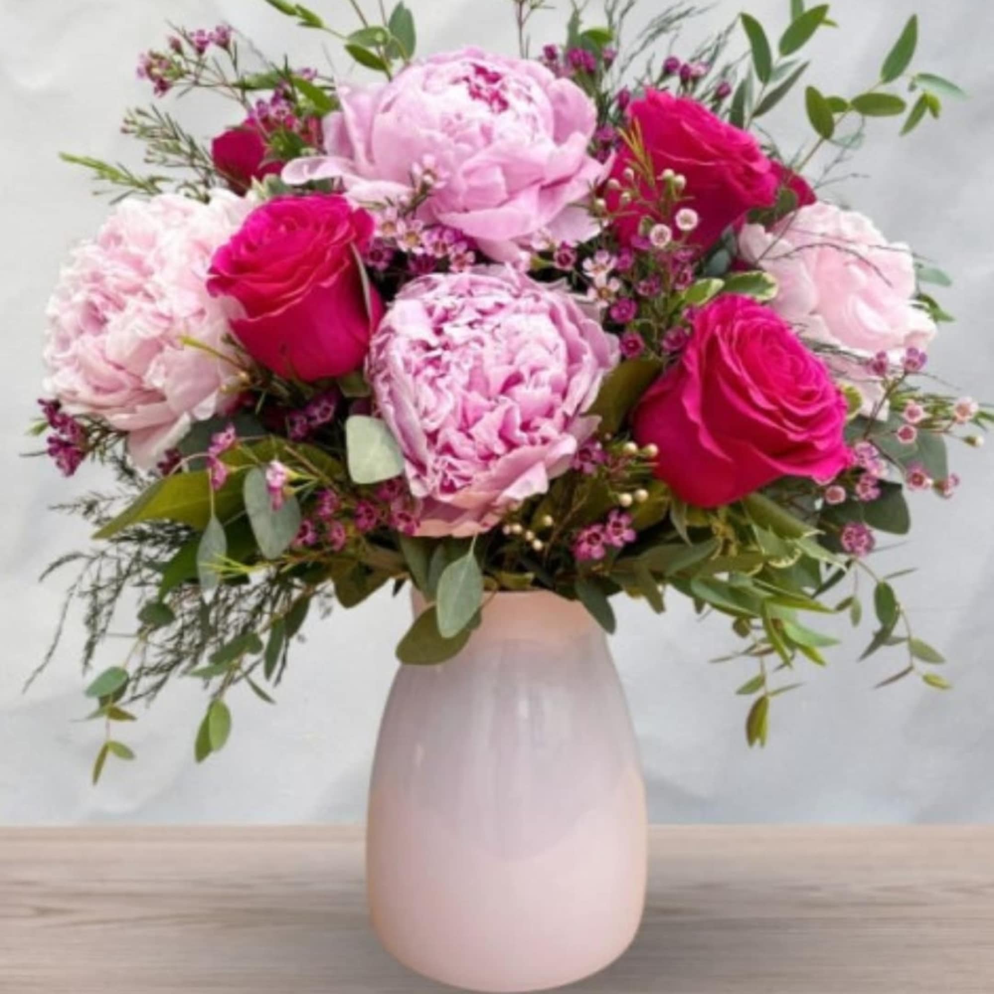 Lush peonies and vivid hot pink roses combine for a romantic
