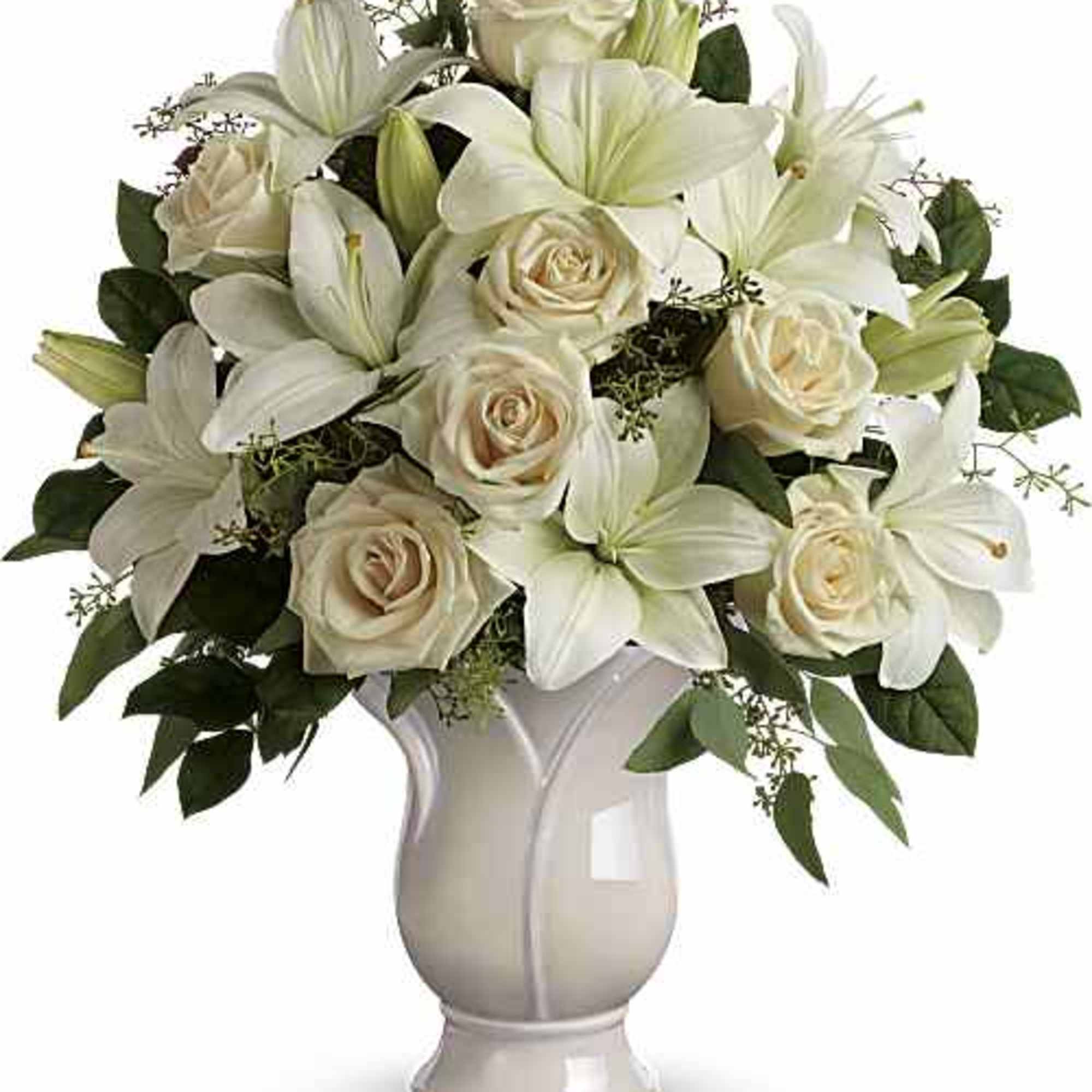 Celebrate a wondrous life with this timeless tribute of pure white lilies