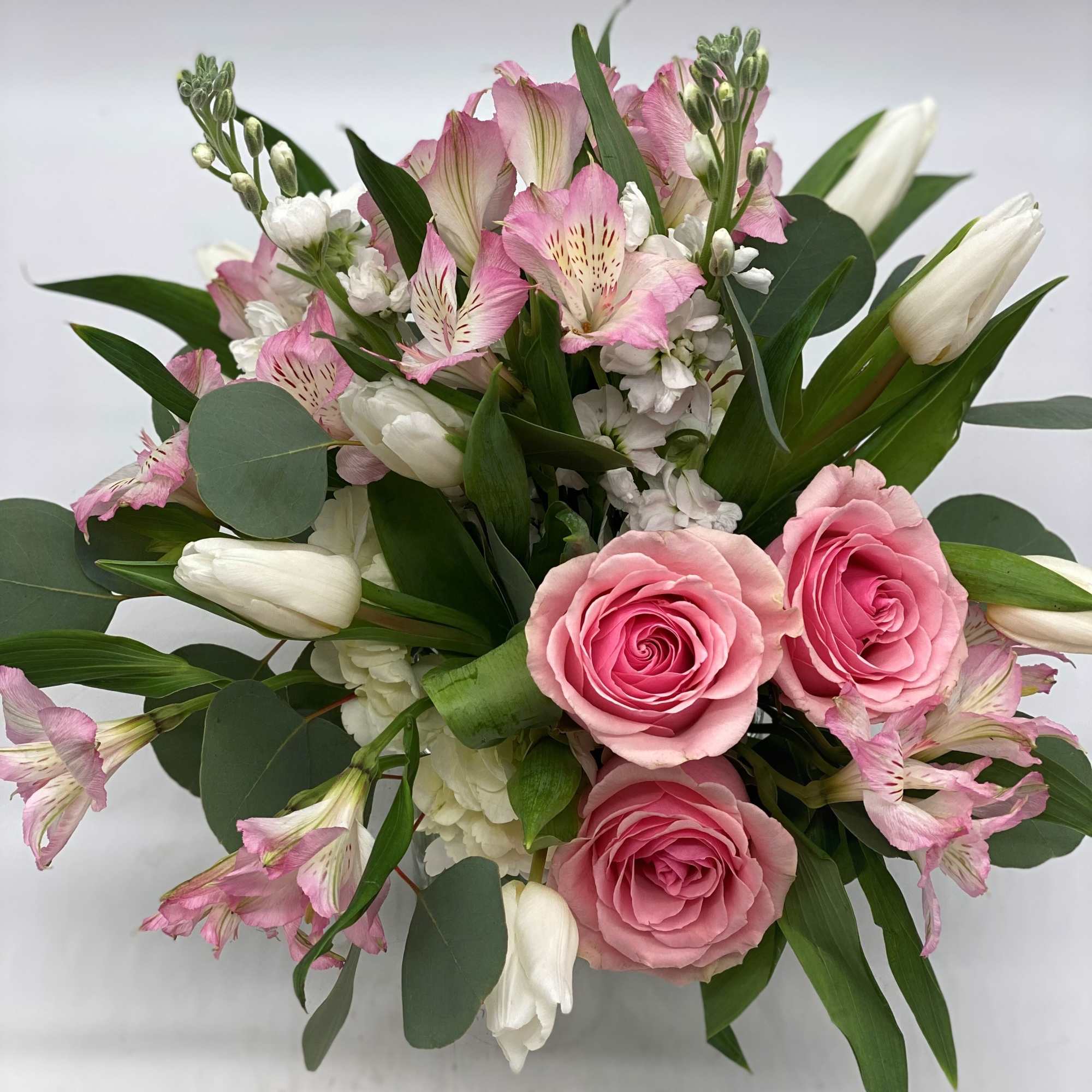 Bouquet of pink roses, white tulips, and pink alstroemeria