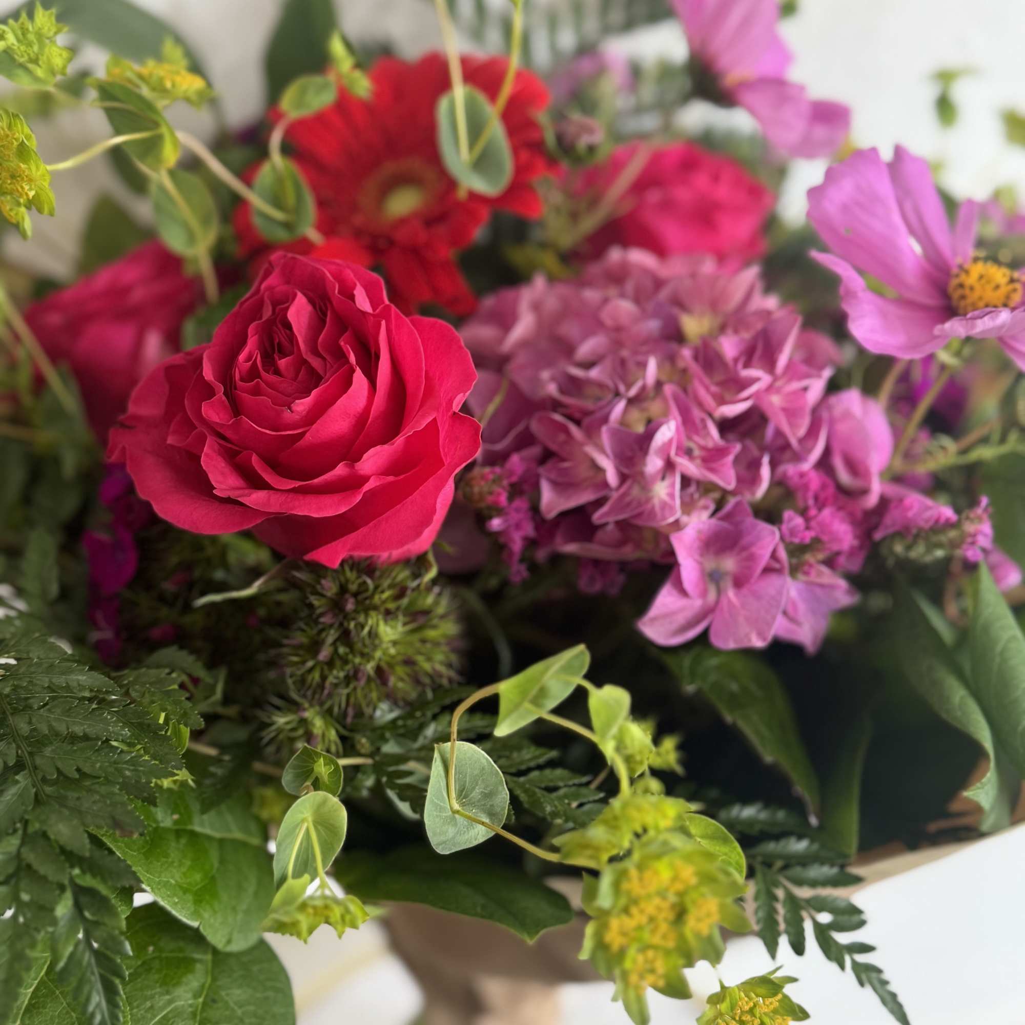 Designers Choice- Lovely bunch of berry toned flowers. Designers Choice may include