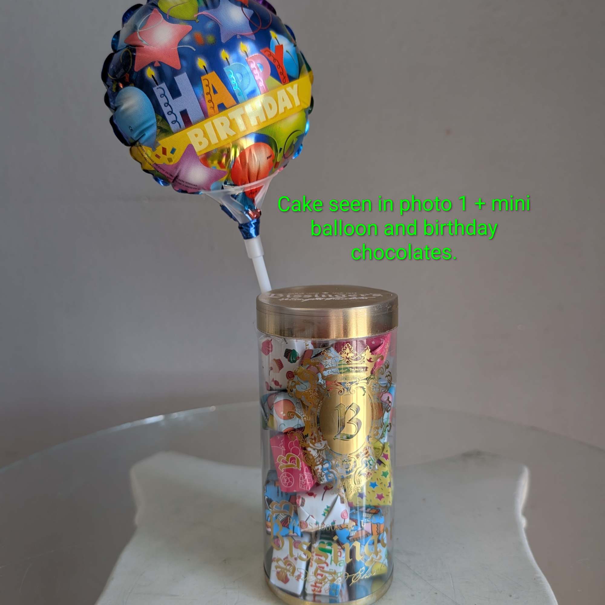 This adorable cake arrangement is sure to put a smile on any