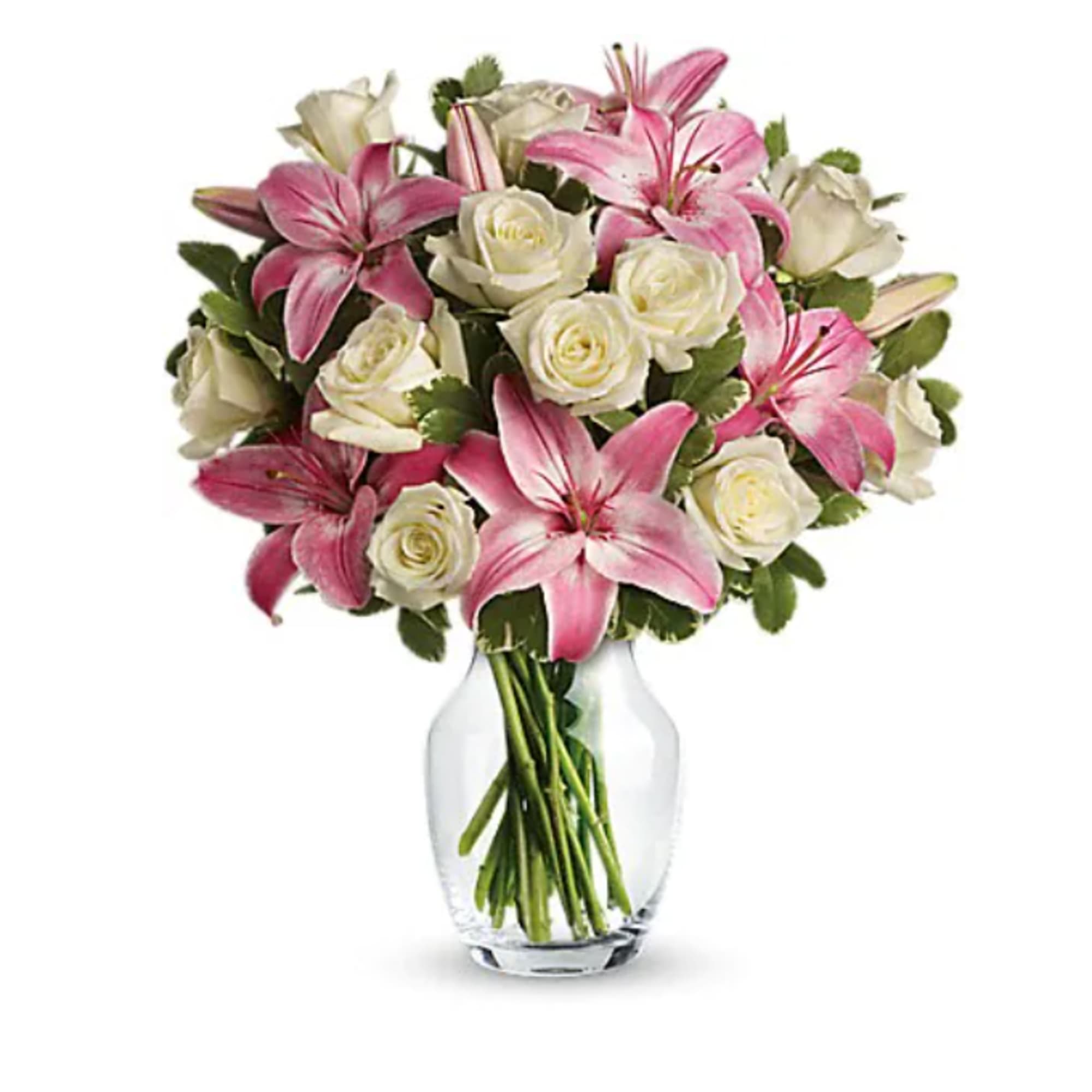 Pink lilies and white roses in a clear glass vase
