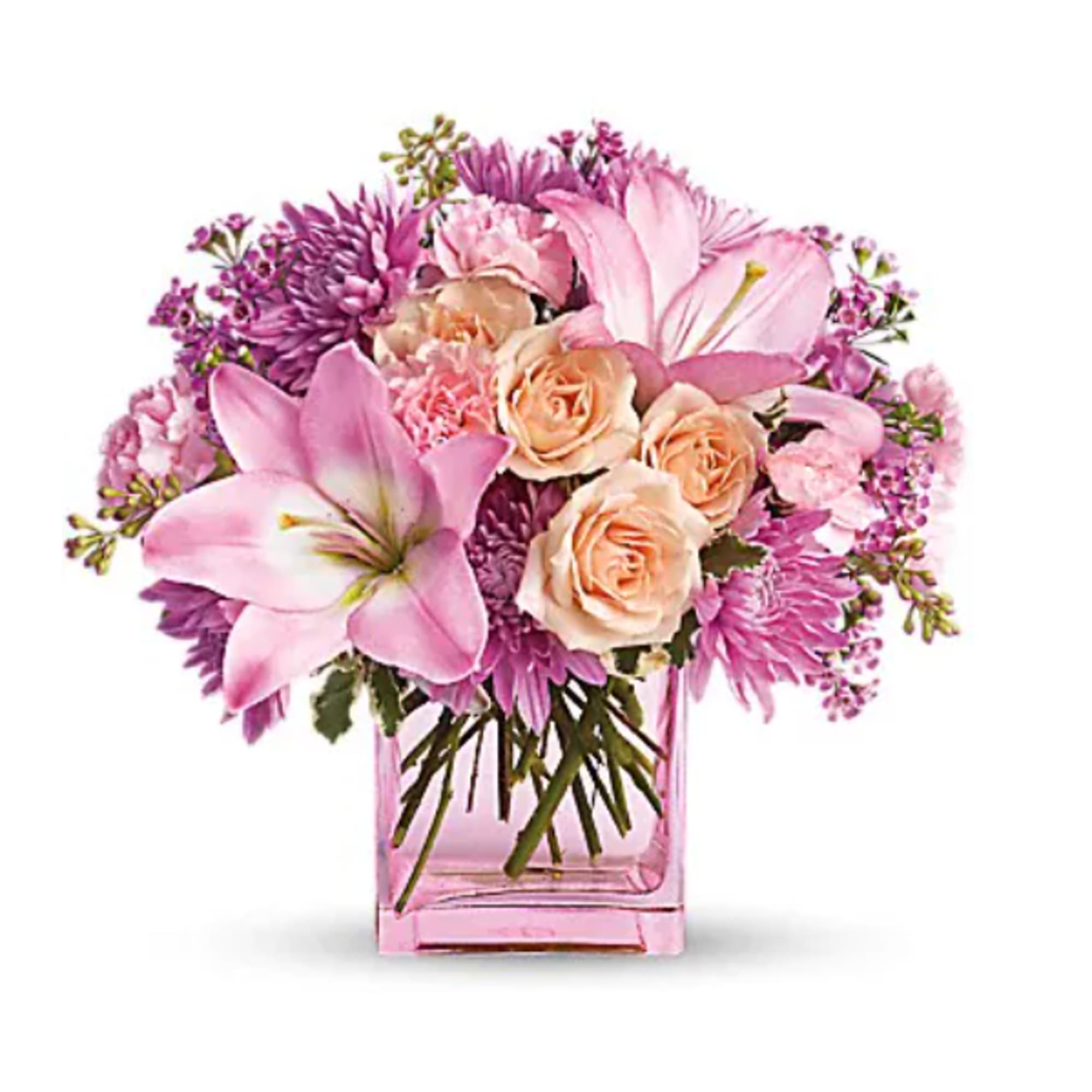 Pink and peach bouquet in a square glass vase