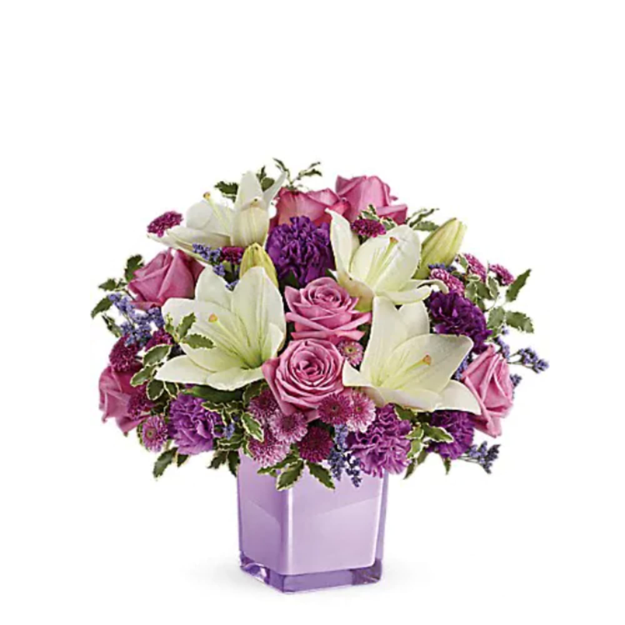 Pink roses and white lilies in a purple glass vase