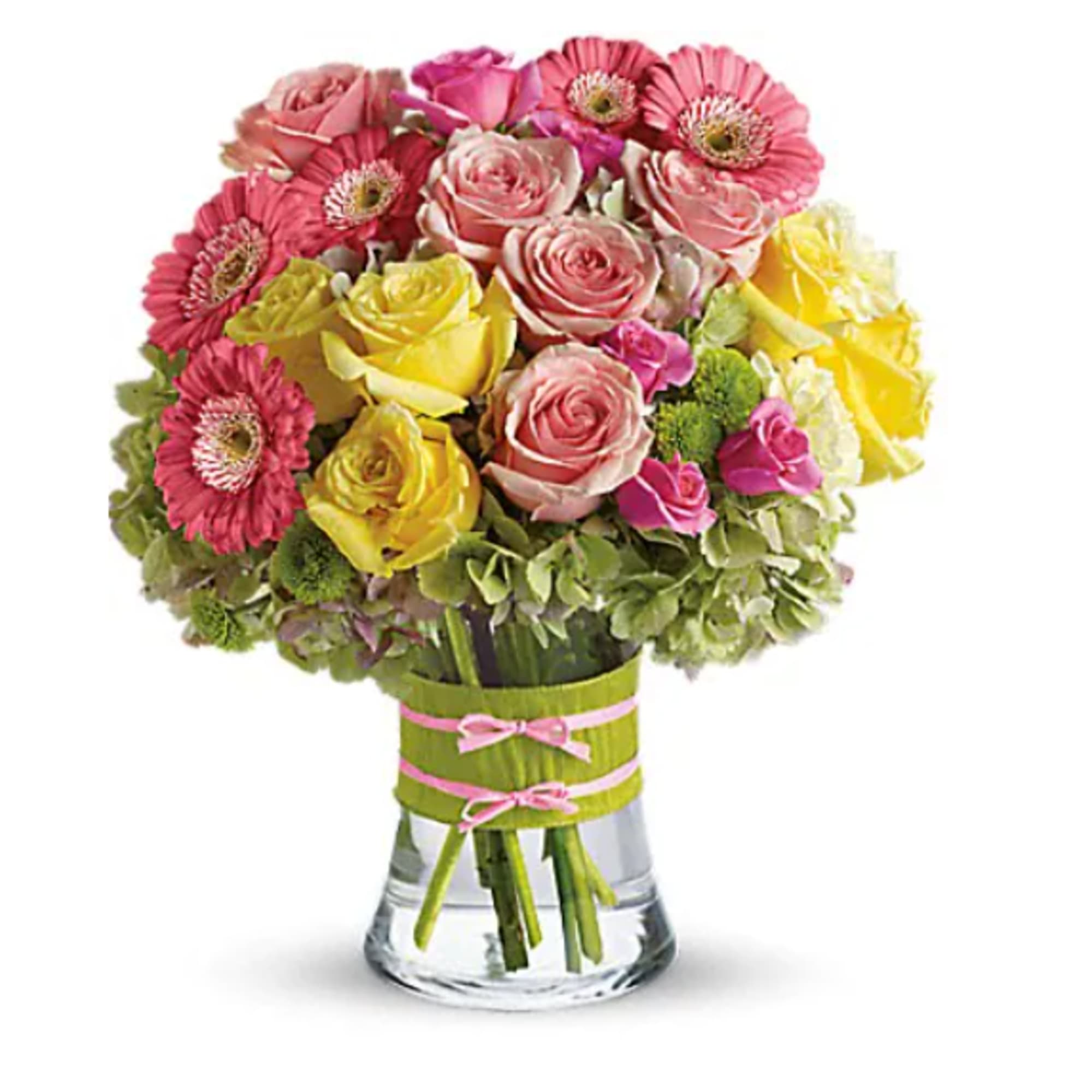 Bouquet of pink and yellow roses with pink gerbera daisies in a glass vase