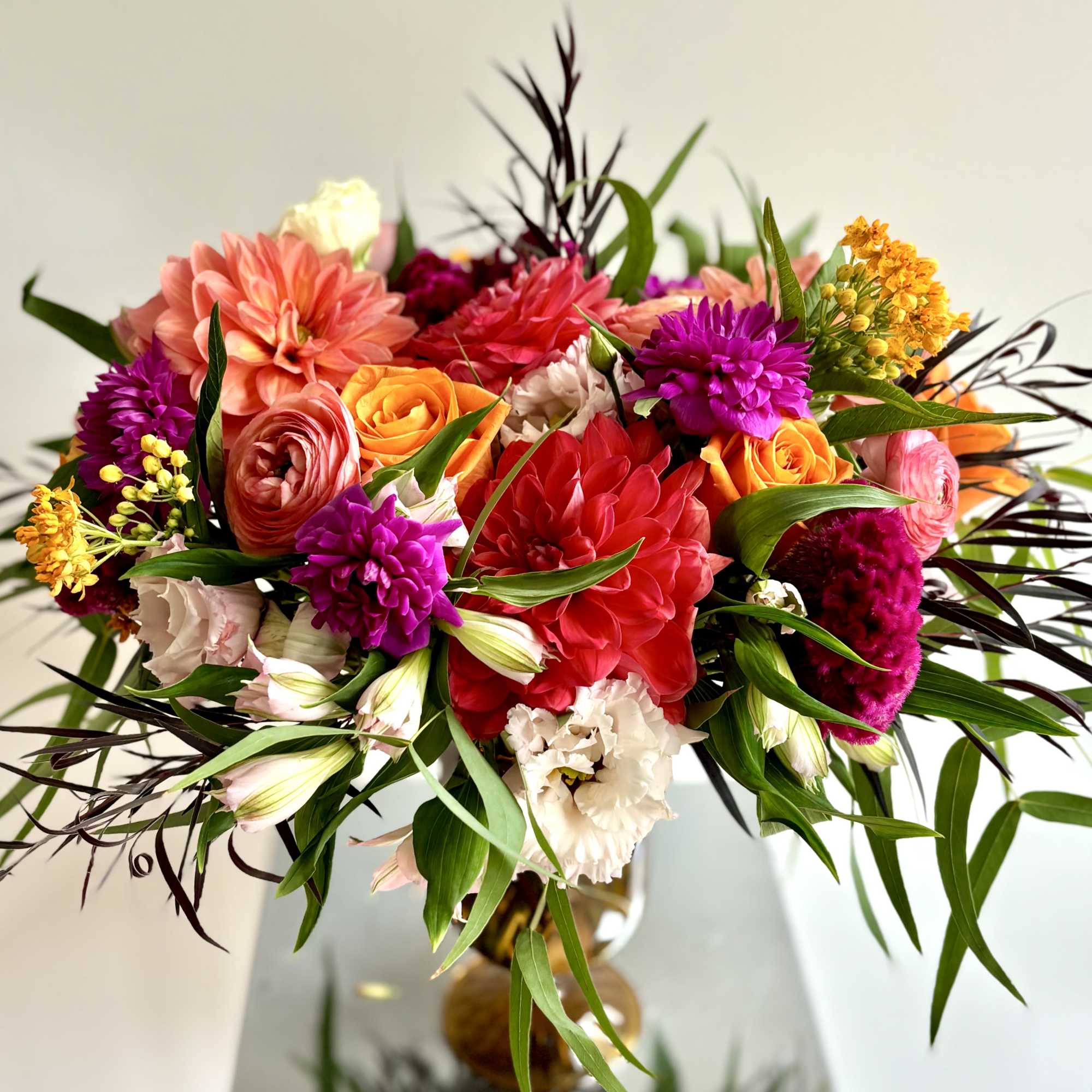 Colorful bouquet of mixed flowers in a glass vase