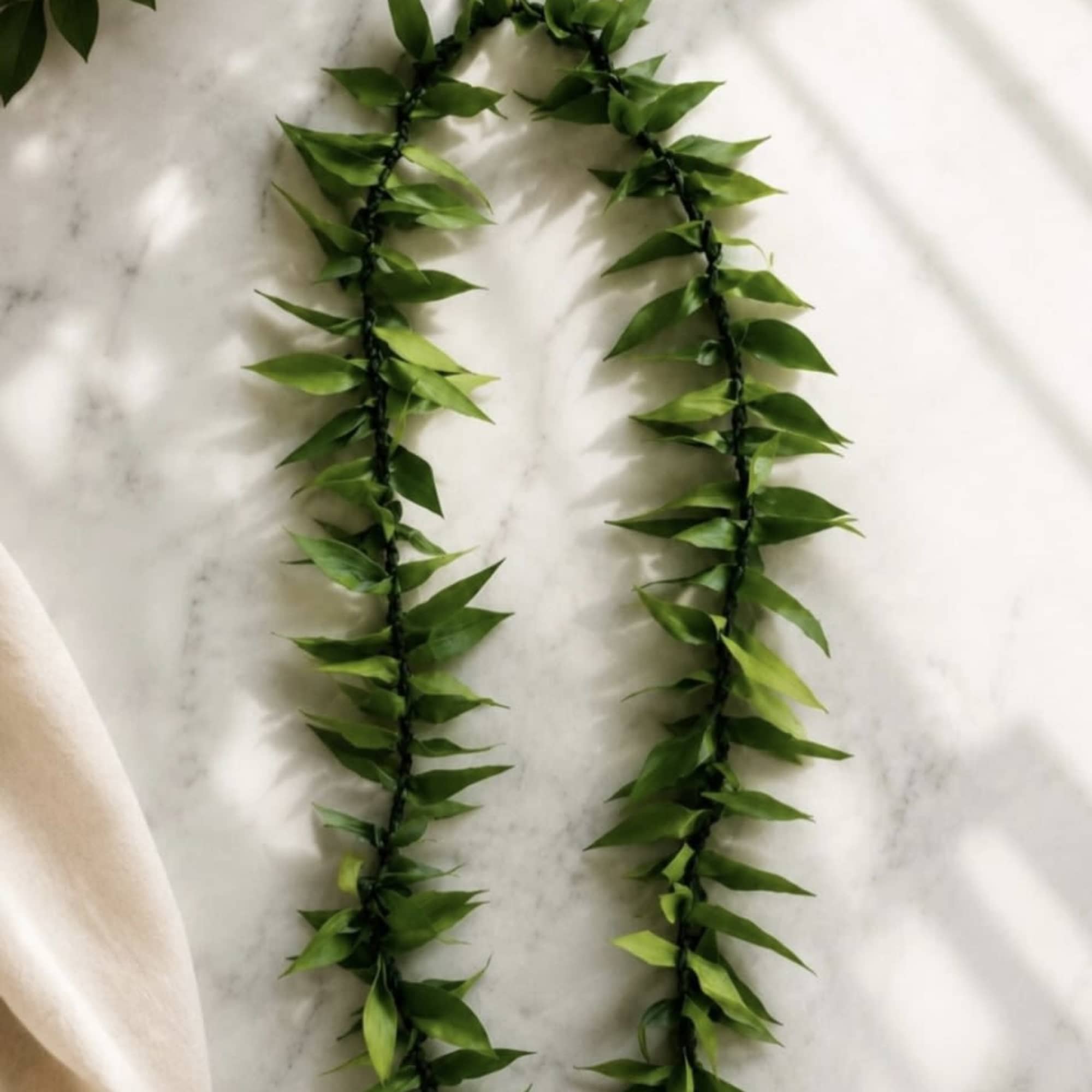 Make their celebration more memorable with a tea leaf lei for their